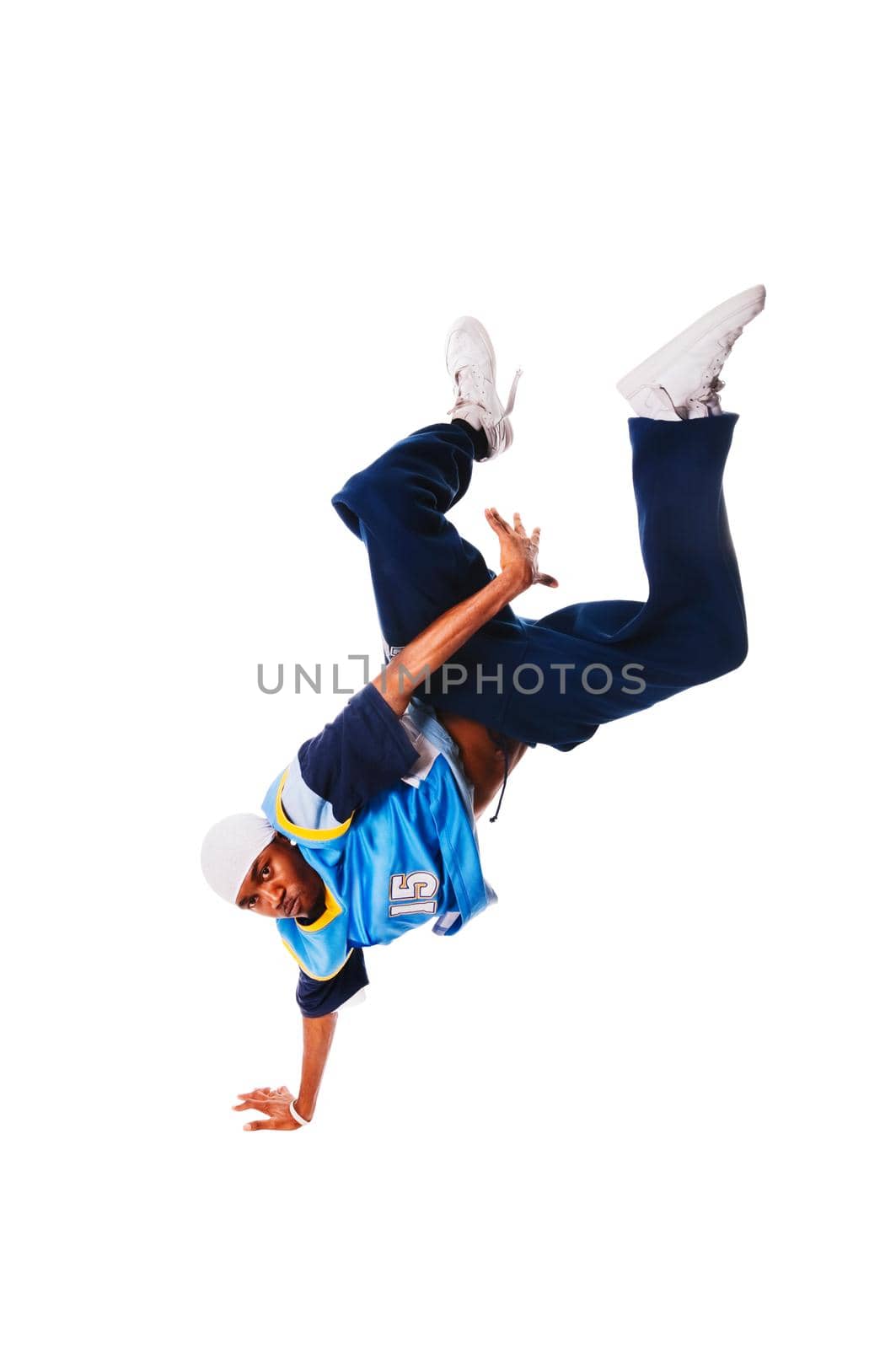 Hip-hop young man making cool move on white background