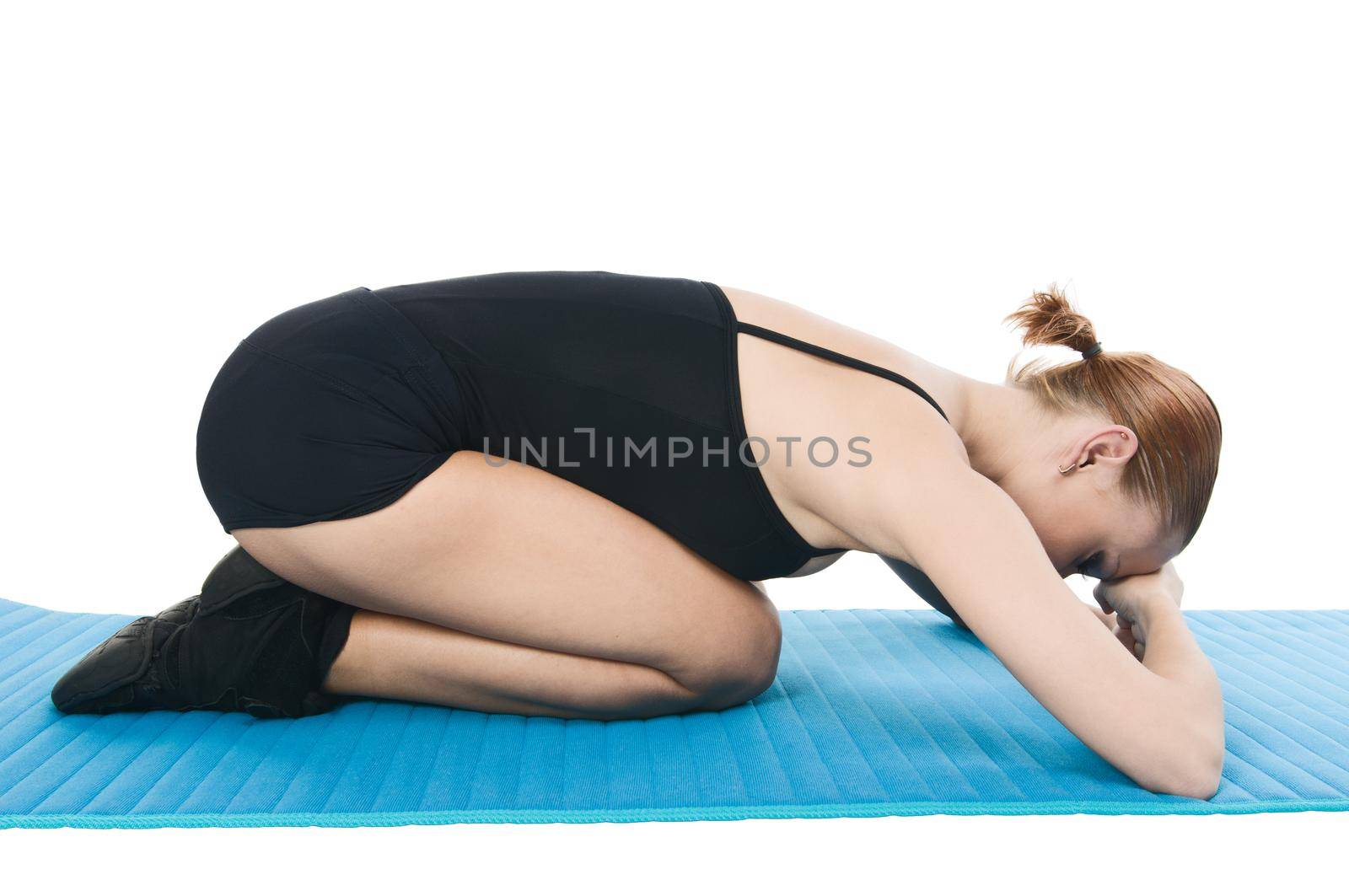 Beautiful slim woman showing relaxational exercises over white