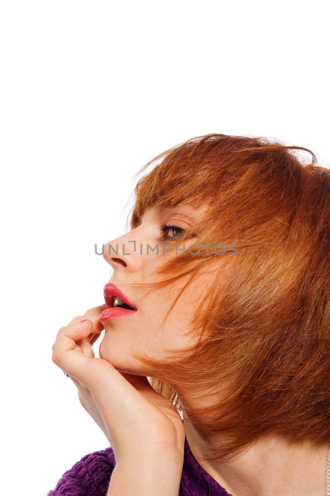 Portrait of a red haired girl isolated on white