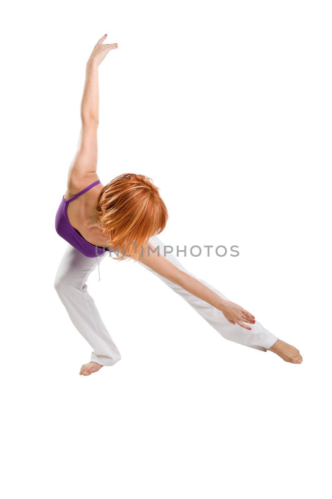 Red haired girl performing fitness exercises by nikitabuida