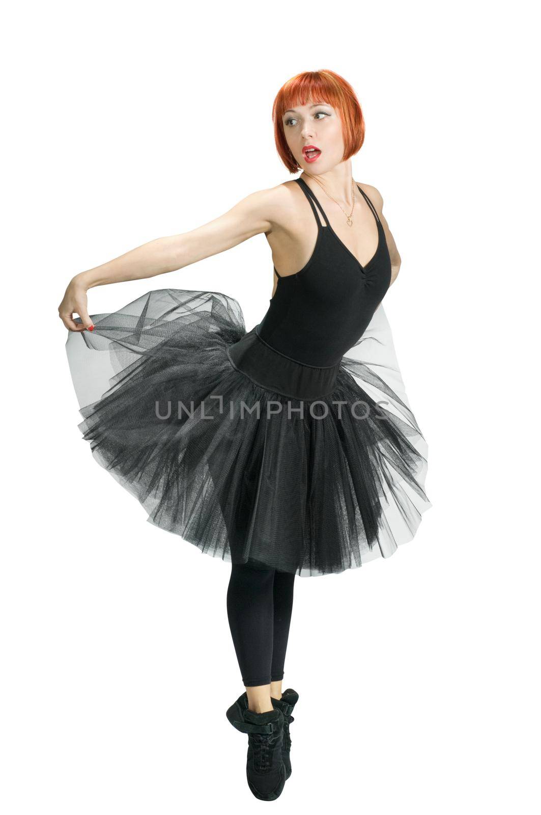 Red ballerina wearing black tutu posing on white background