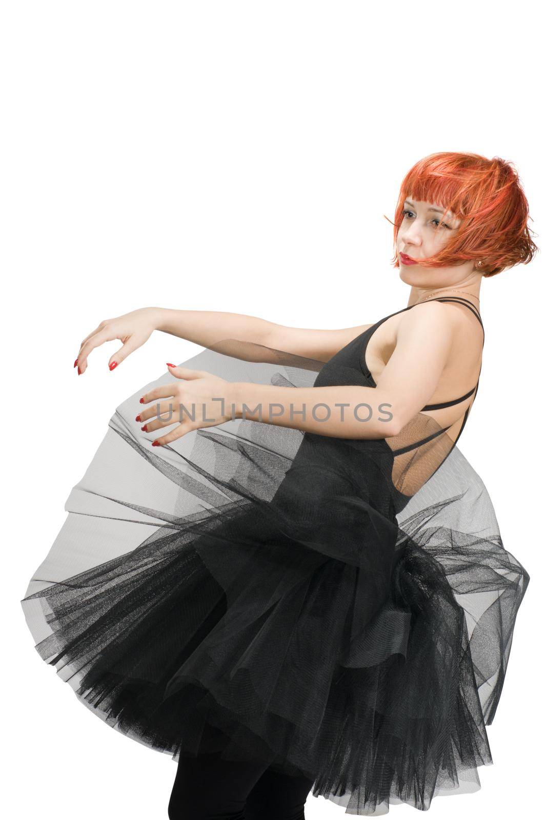 Beautiful red-haired ballerina wearing tutu on white background