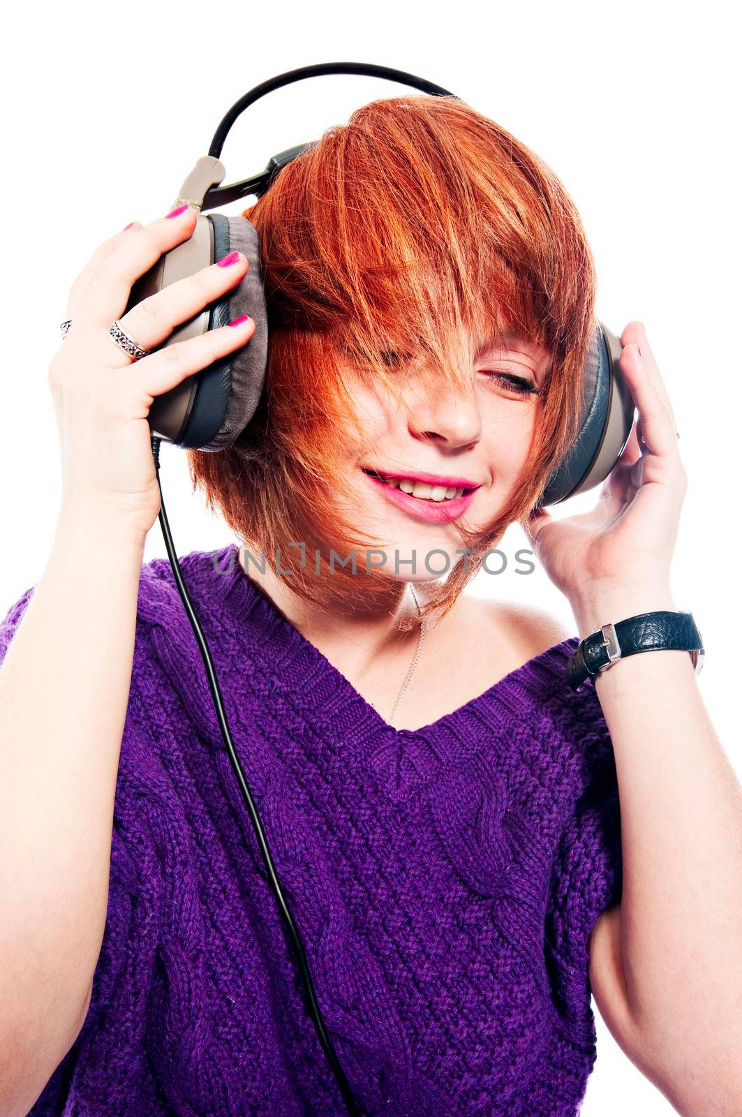 Red-haired girl listening to the music