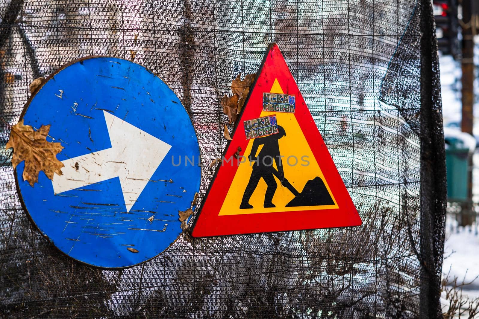 Warning road signs located in working area. Bucharest, Romania, 2021 by vladispas