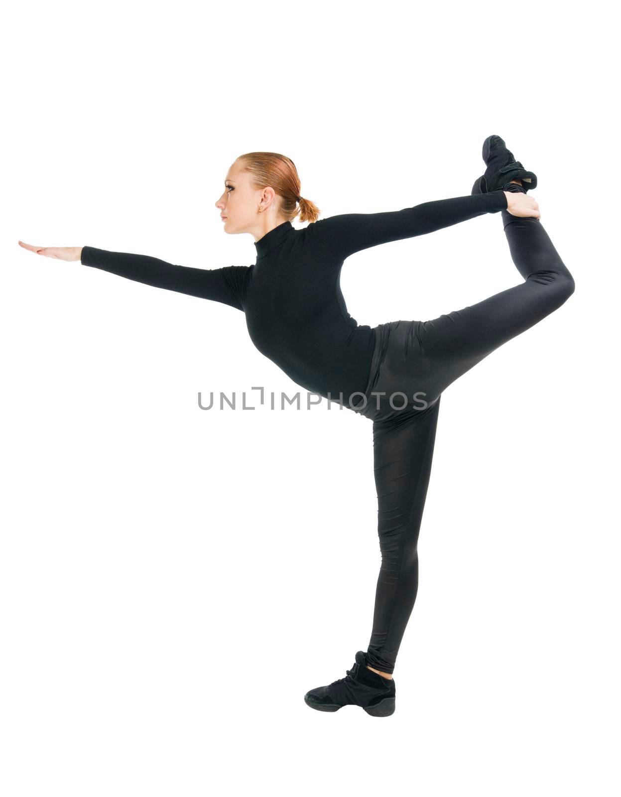 Beautiful modern dancer wearing black on white background.
