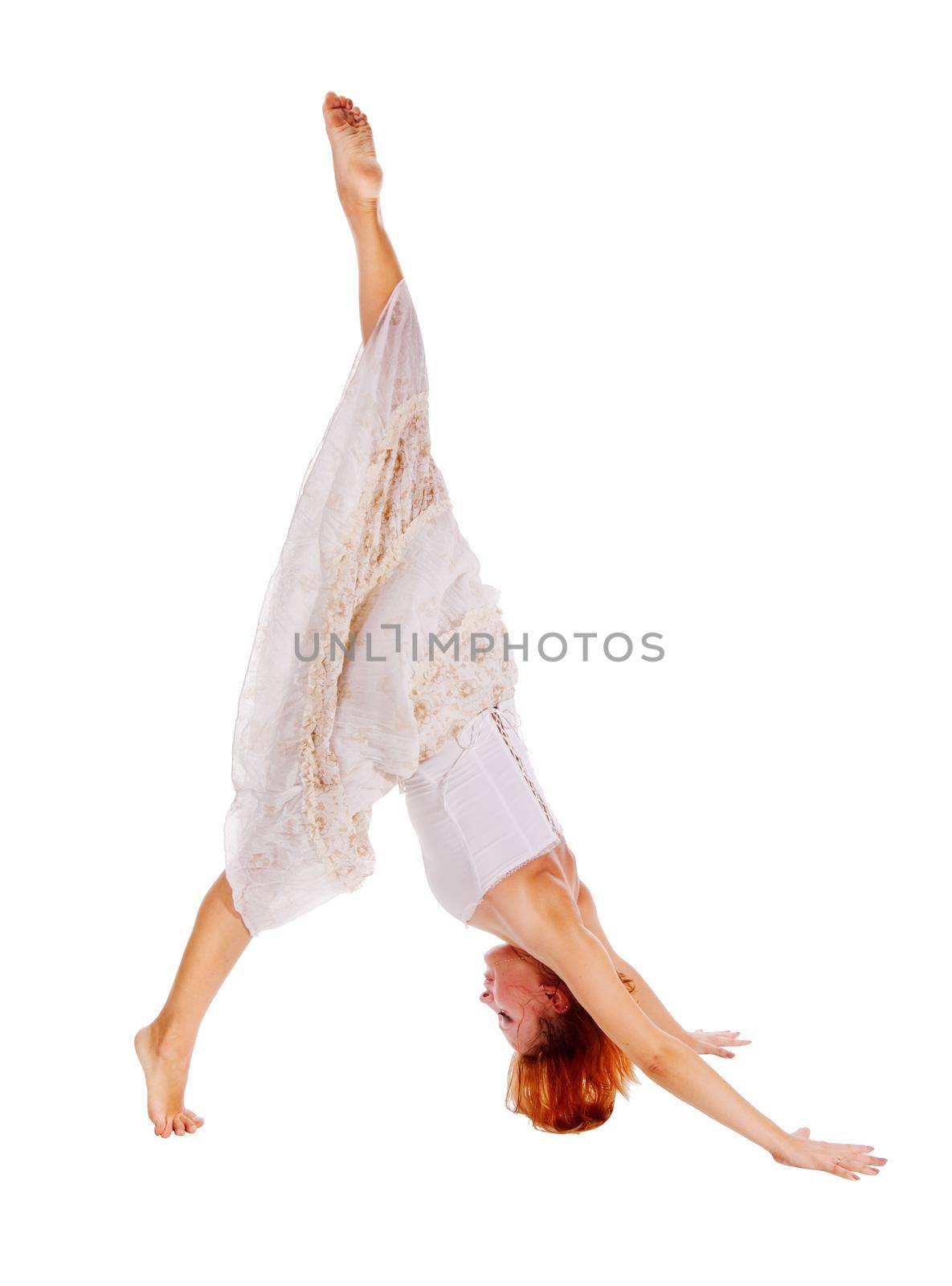 beautiful girl acrobat isolated on white