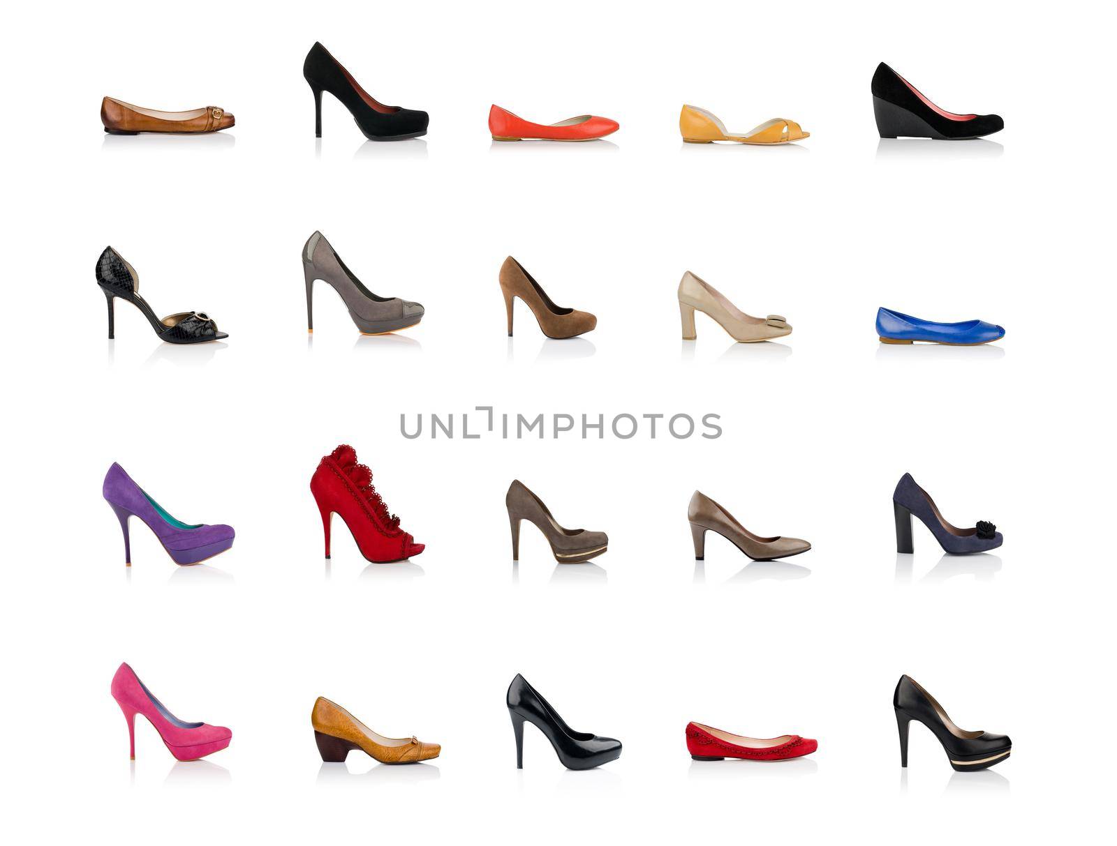 Many fashionable female shoes shot in profile on white background with reflection