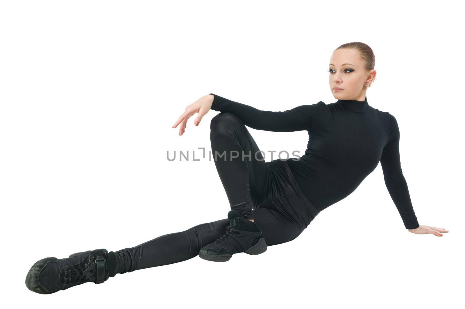 Beautiful ballet dancer wearing black clothes on white
