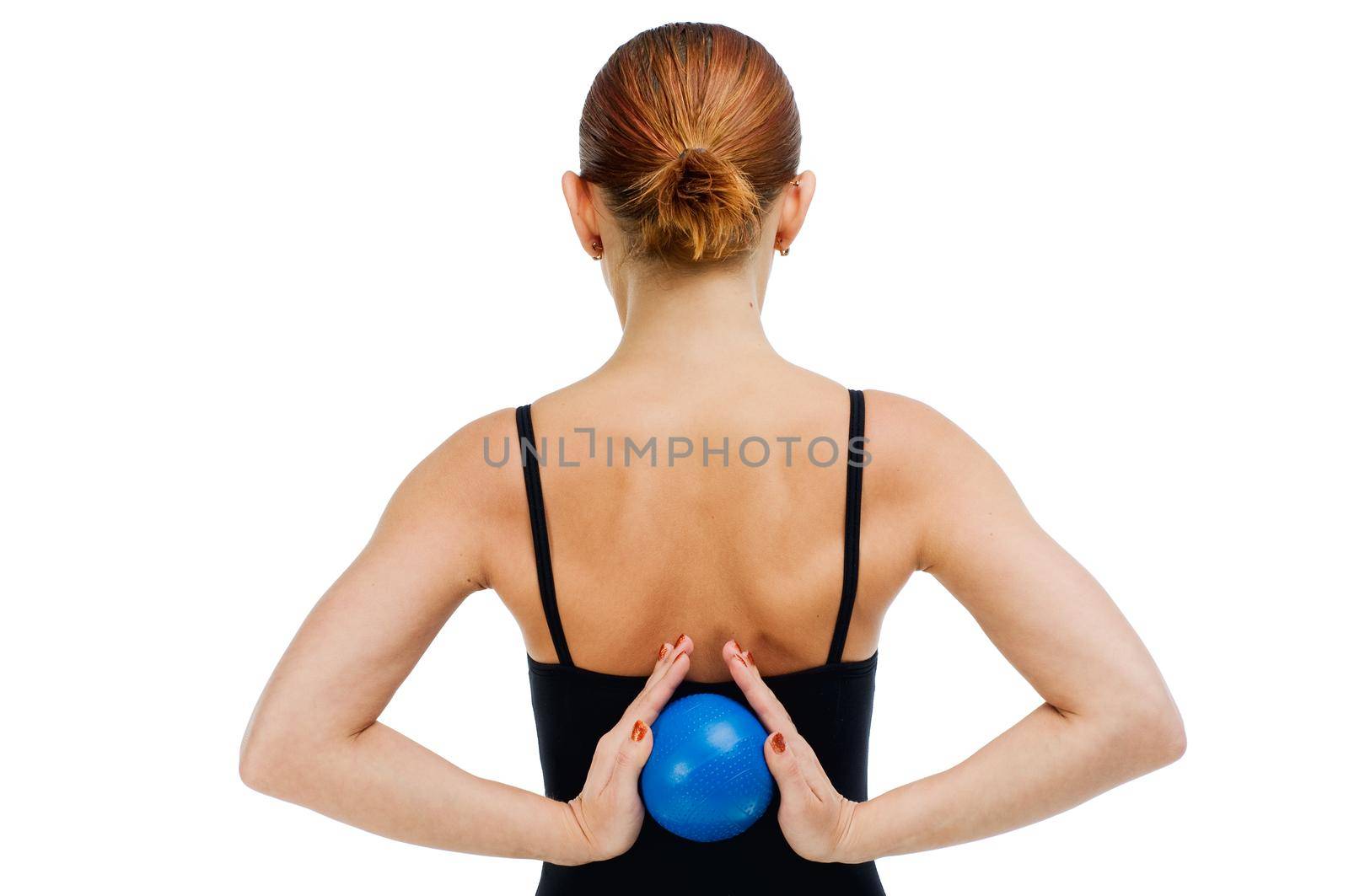 Beautiful fit red girl working out with blue ball