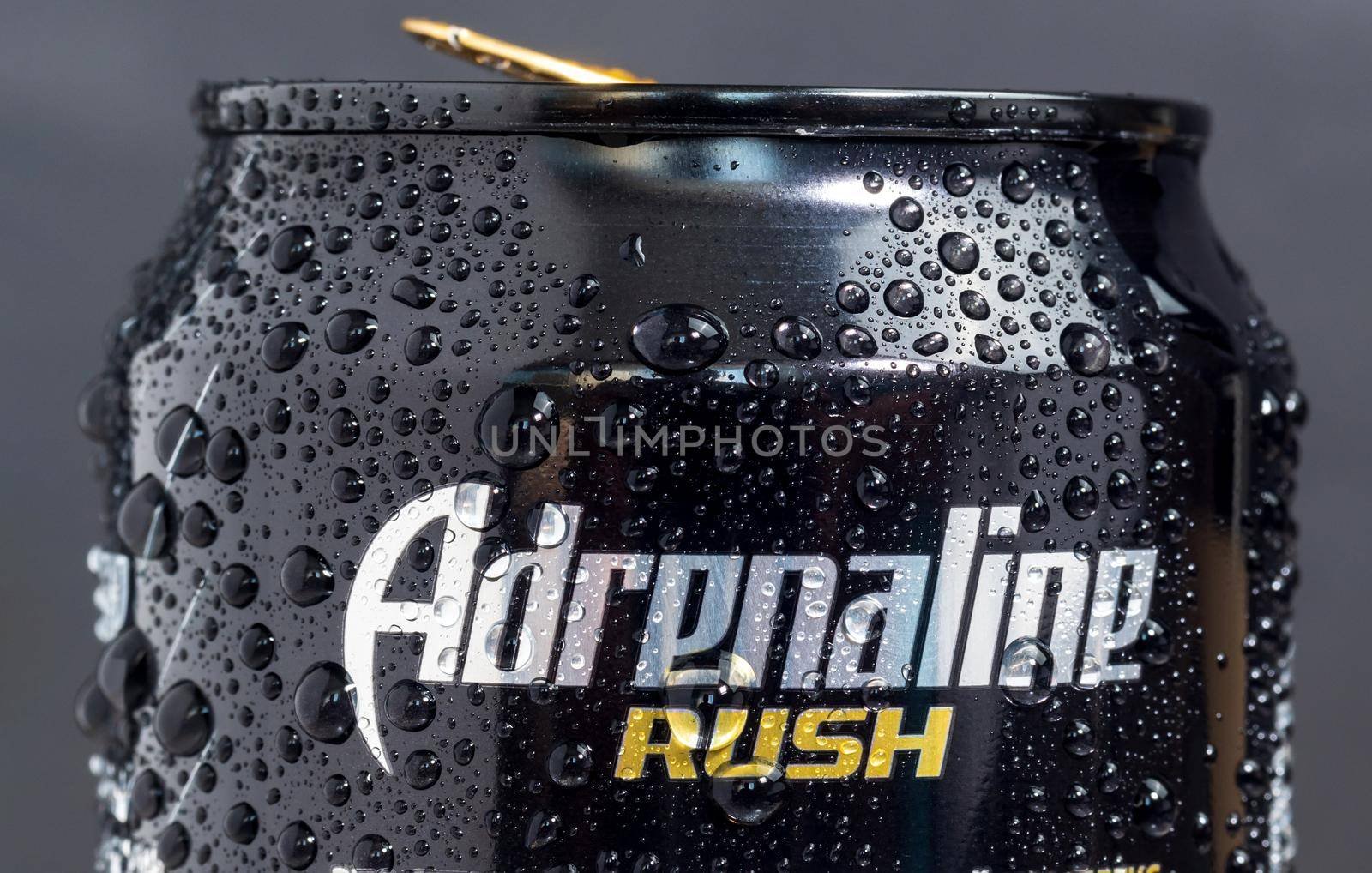 Tyumen, Russia-May 25, 2021: Adrenaline Rush Energy drink, metal can. Close up. Black background