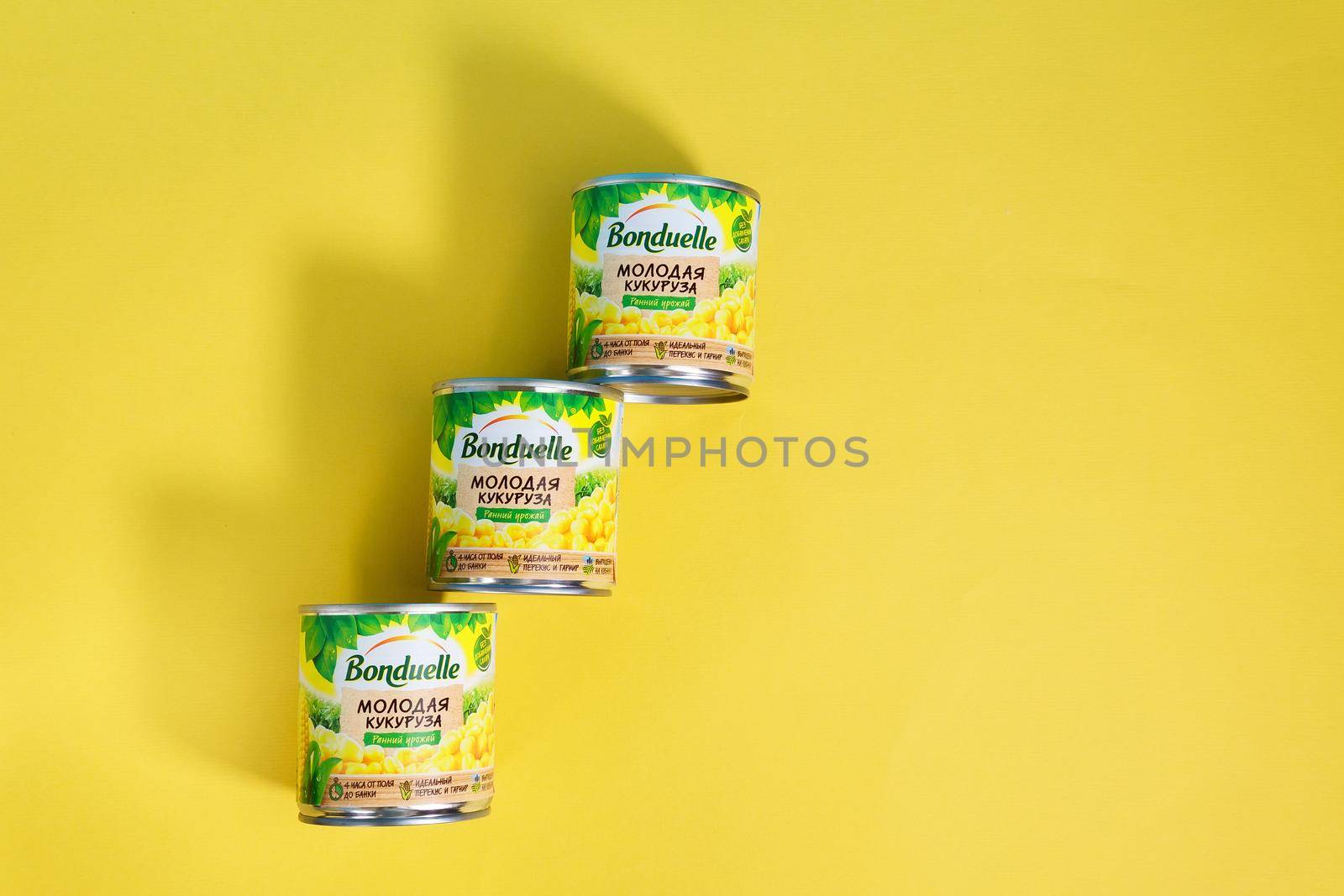 Tyumen, Russia-april 17, 2021: Bonduelle corn in tin cans on a multicolored yellow background by darksoul72