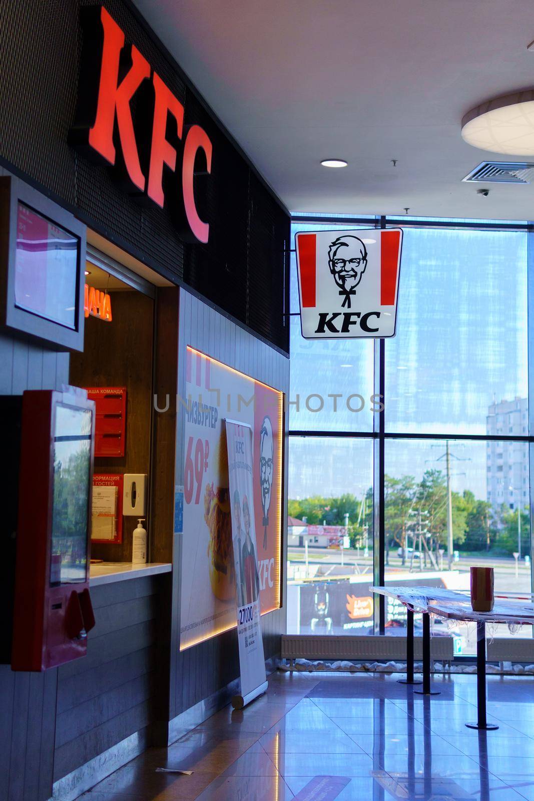 Tyumen, Russia-August 12, 2021: KFC logo fast food restaurant chain specializing in chicken dishes