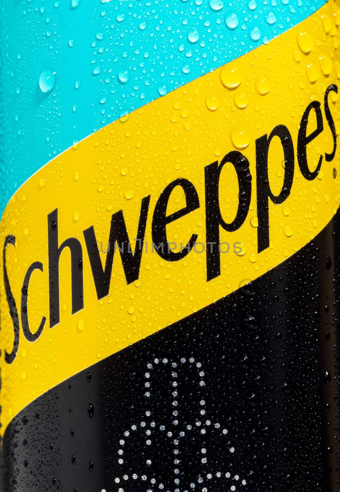 Tyumen, Russia-May 25, 2021: Can of the Schweppes logo close up. Water drops. by darksoul72