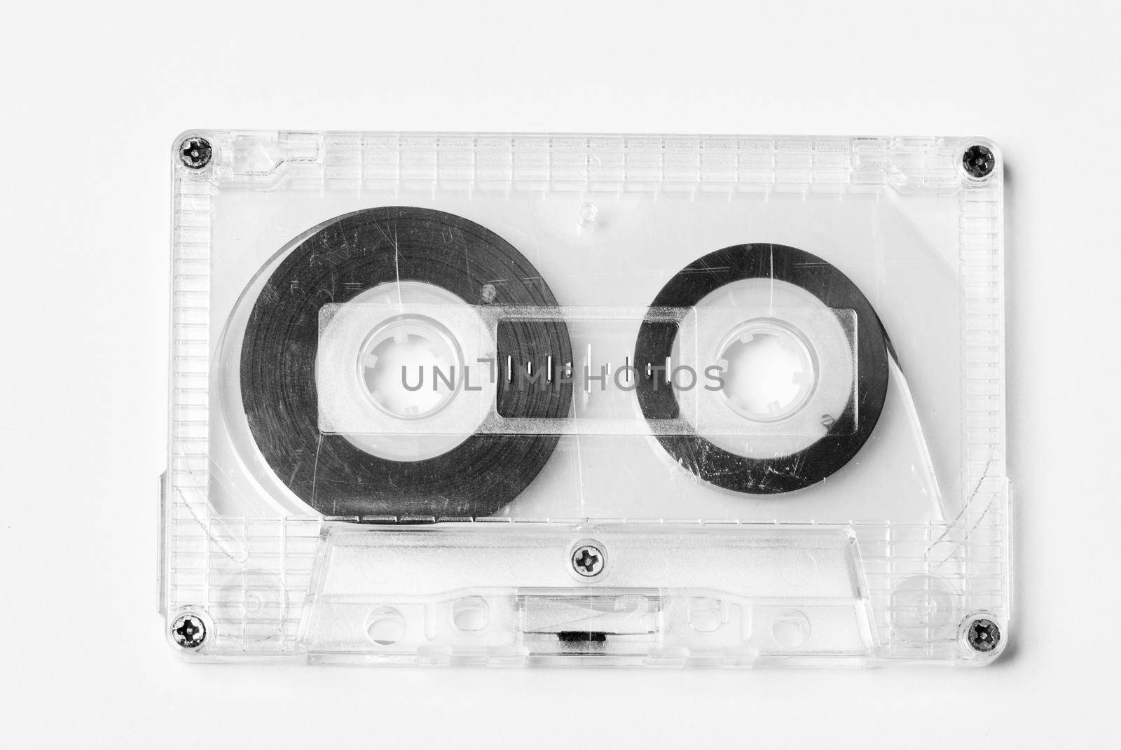 Old plastic audio cassette isolated on white
