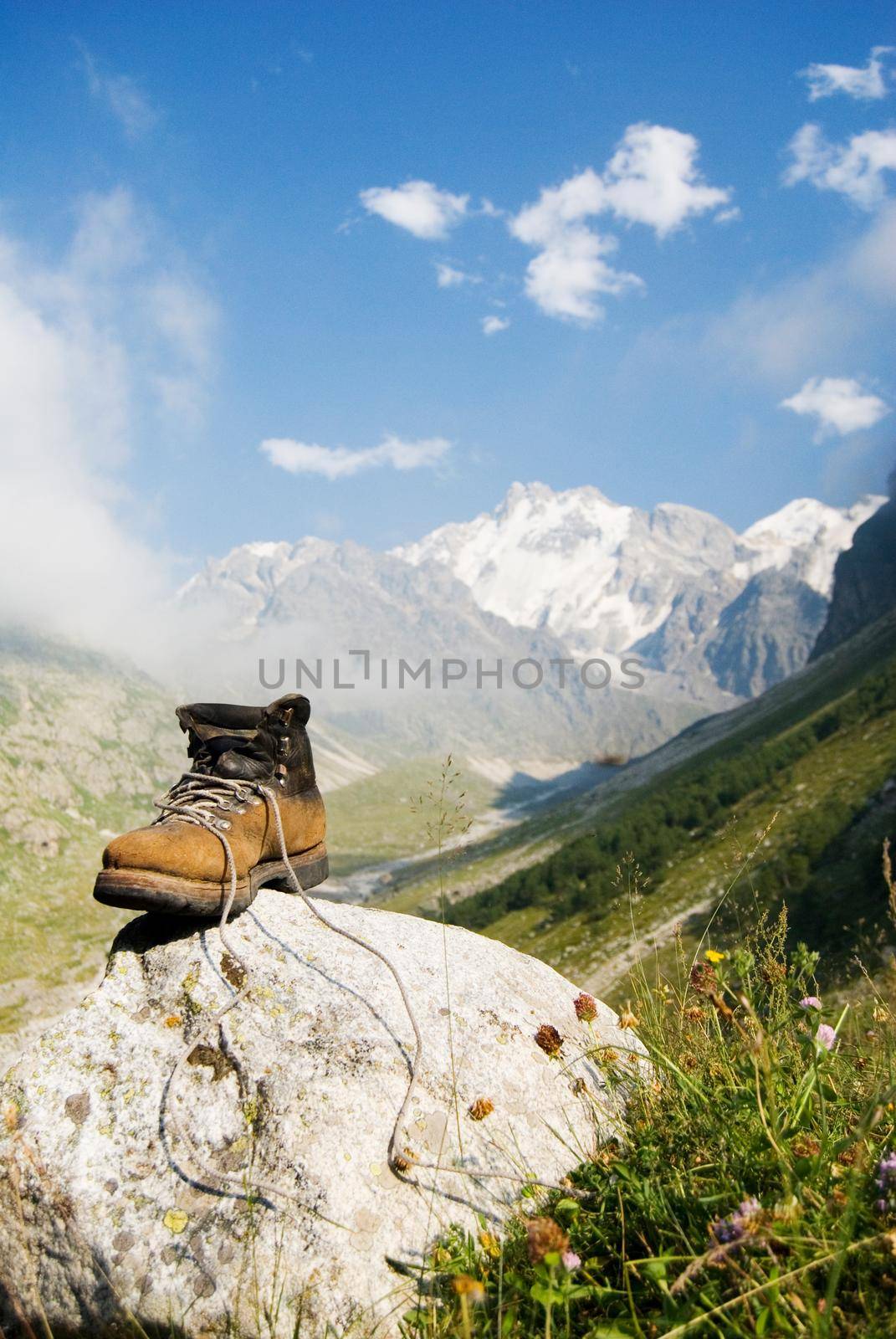 Vintage climber boot is being dried in the base camp in Caucasian mountains