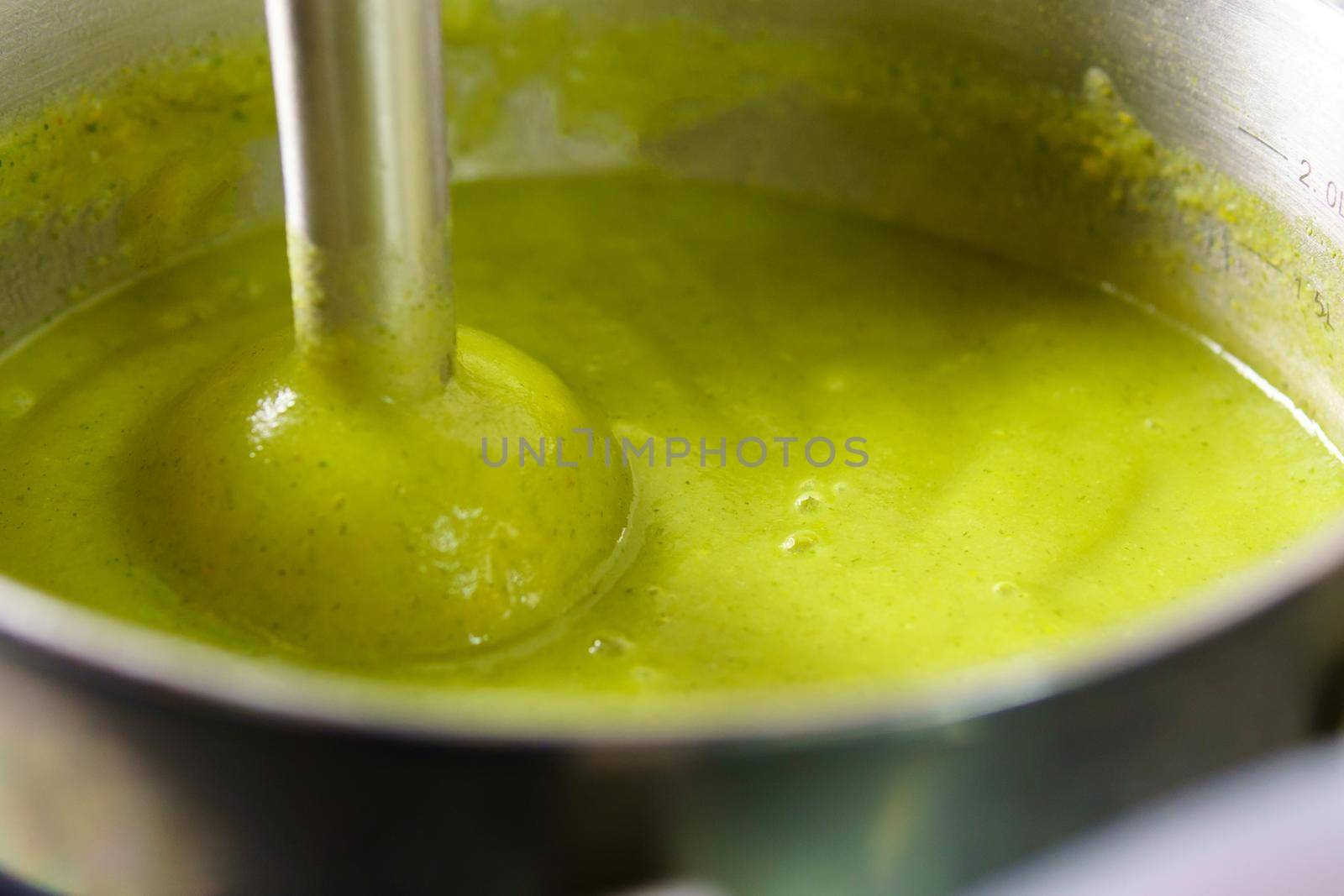 Preparation of broccoli puree soup with a blender. Vegetable cream soup