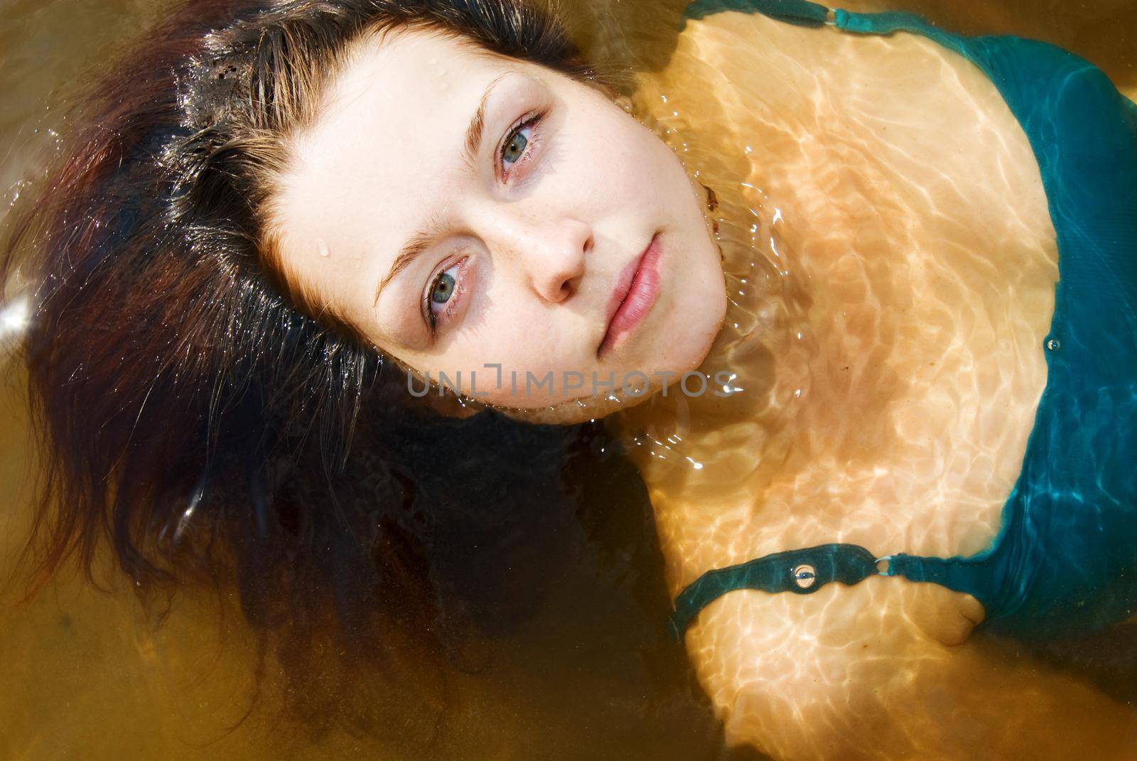 Beautiful young girl on a water therapy session