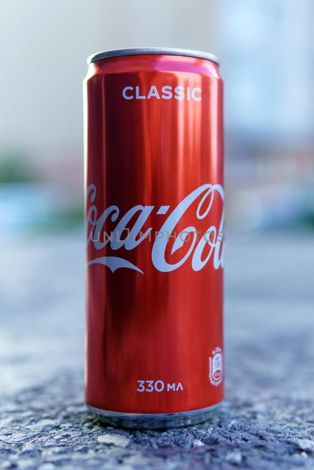 Tyumen, Russia-May 29, 2021: Coca cola carbonated drink. Vertical photo. Selective focus
