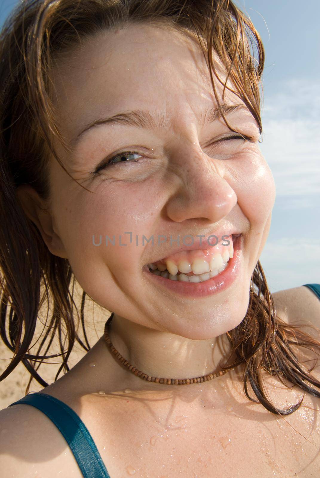 Cheerful red haired girl winking