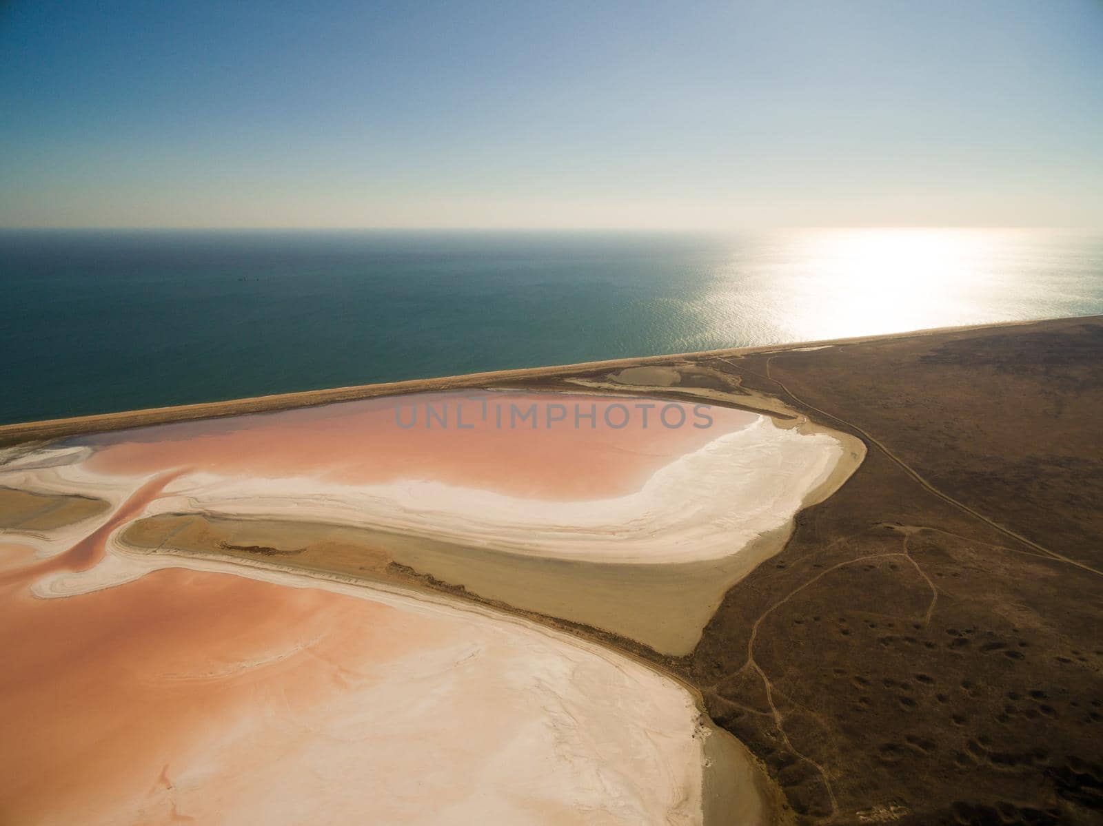 Aerial shot of Koyashskoe pink salt lake firth in Crimea