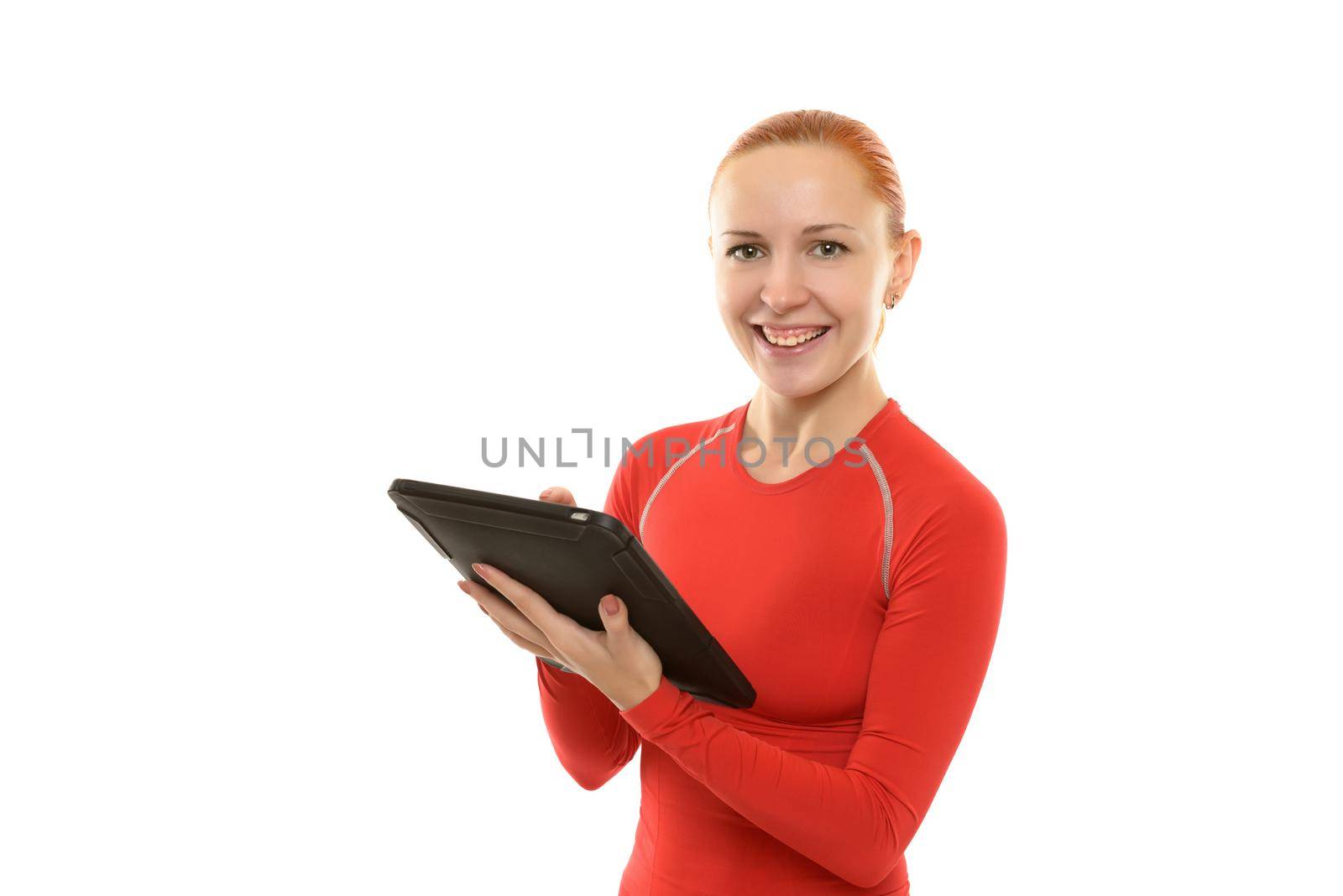 Happy sporty young woman with ipad over white background