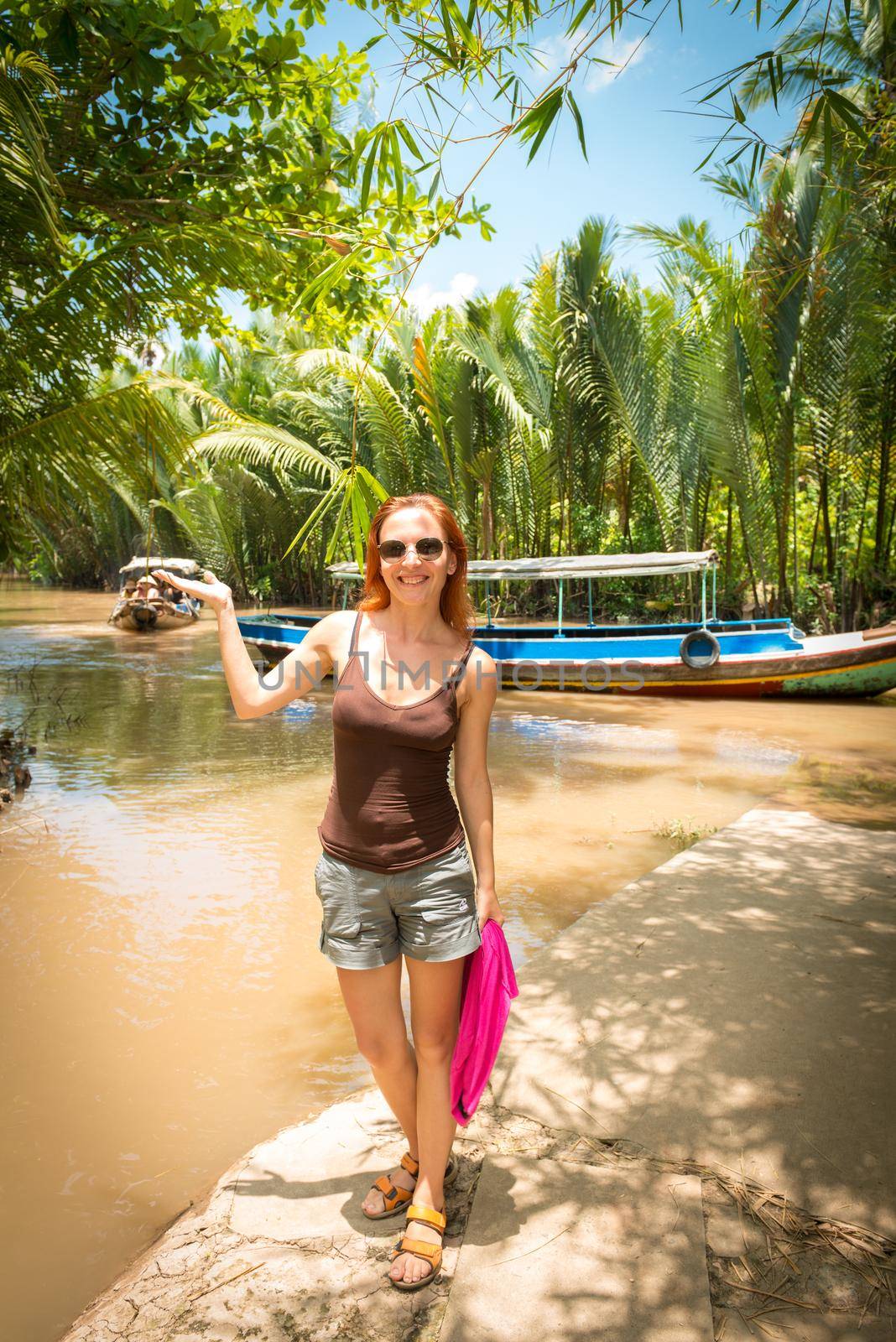 Tourist enjoying Mekong delta cruise with daily trips to local sights