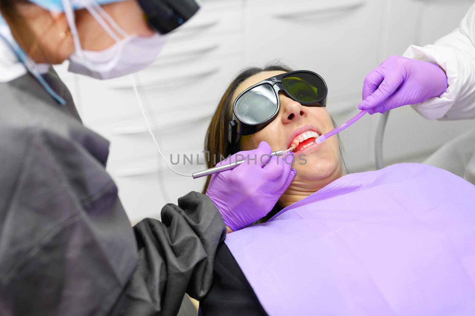 Dentist Using A Modern Diode Dental Laser by HERRAEZ