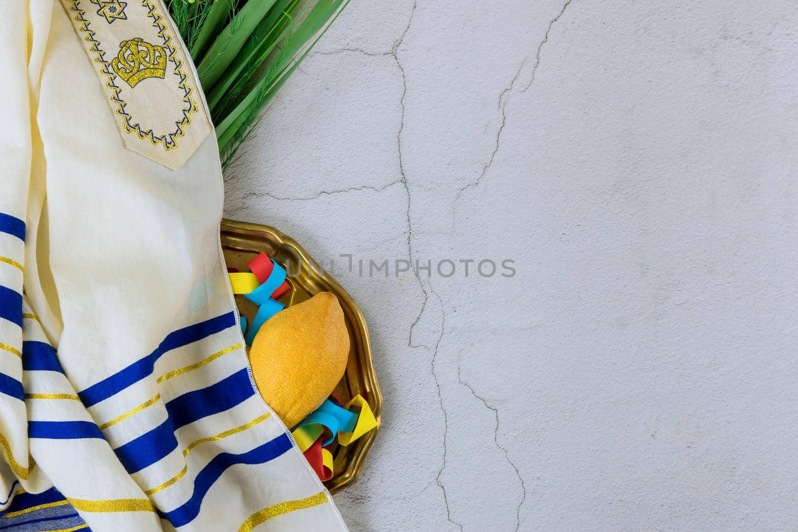Jewish holiday of symbols of the festival Sukkot with palm leaves by ungvar