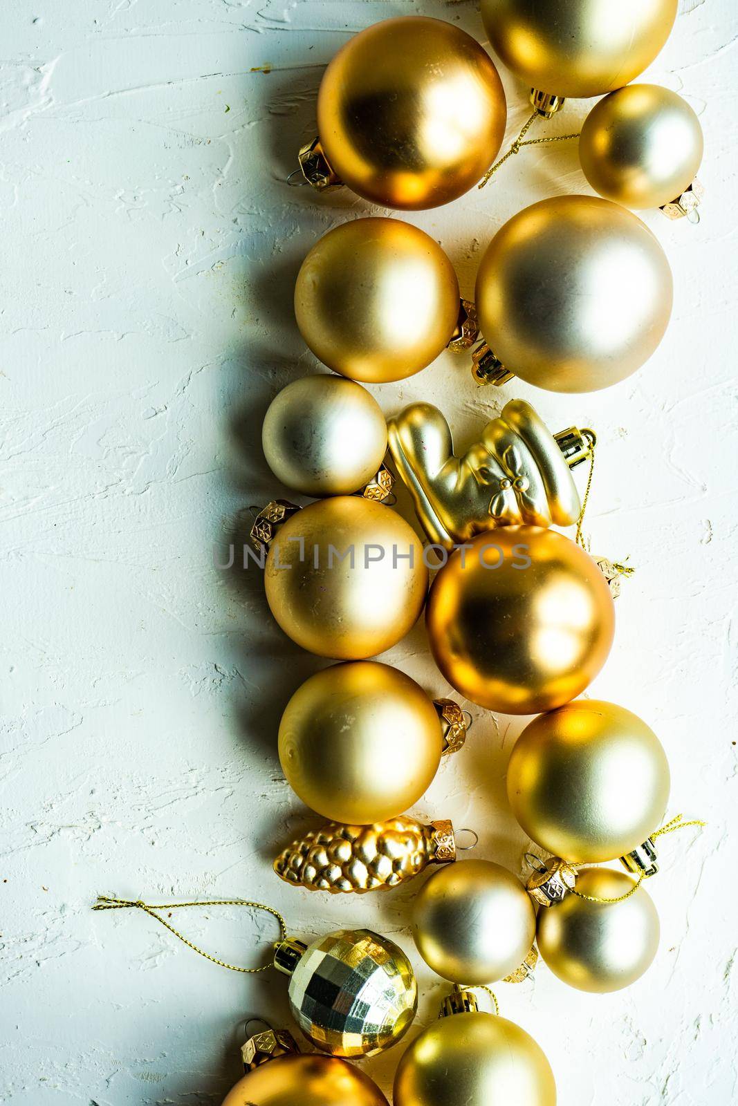 Christmas card concept with variety of holiday festive balls on concrete background