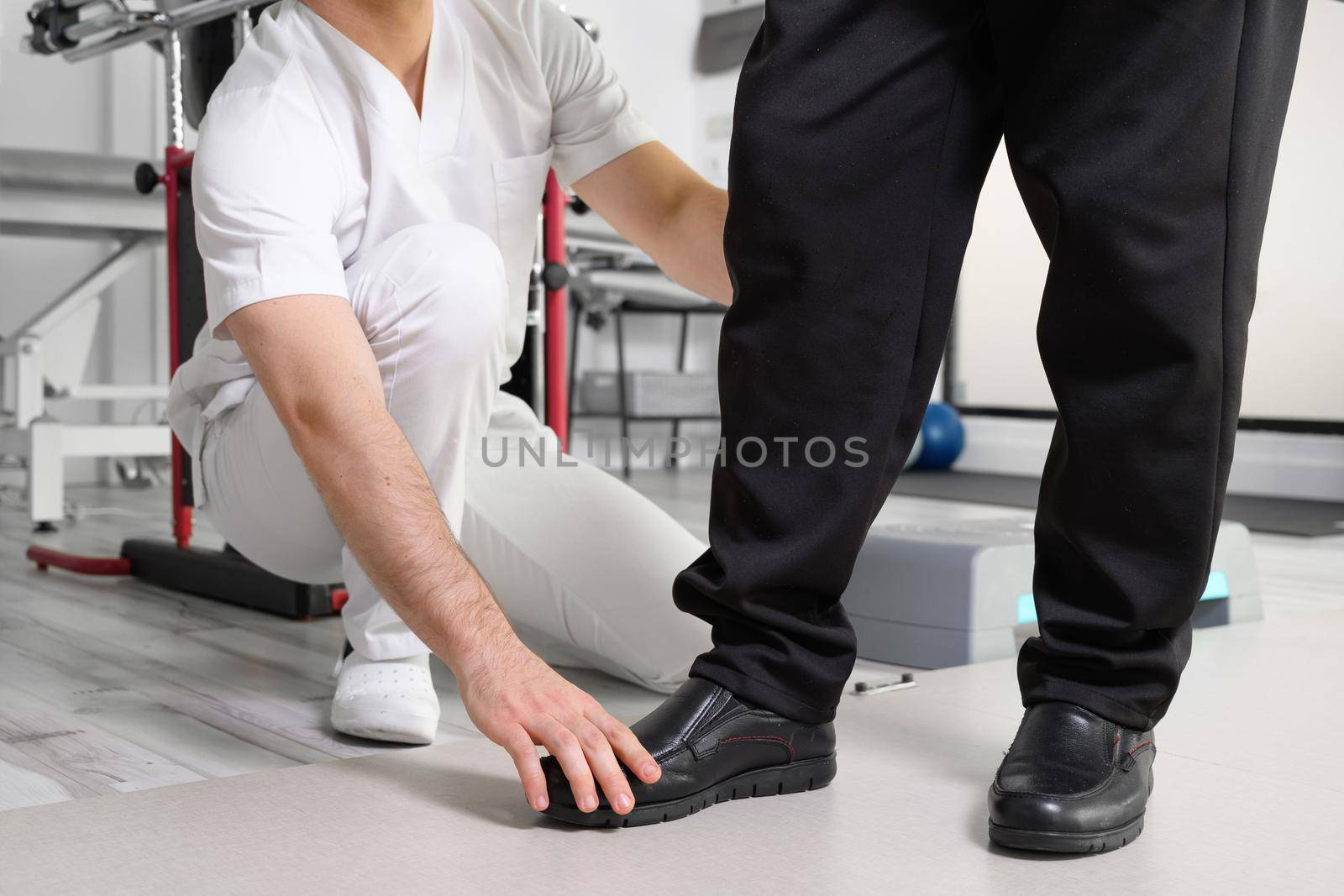 Senior Patient and physical therapist in rehabilitation walking exercises. High quality photo