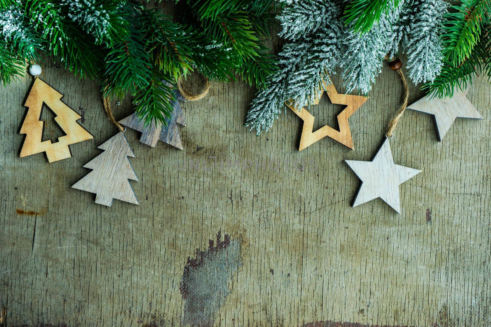Christmas card concept with wooden xmas decoration on vintage background