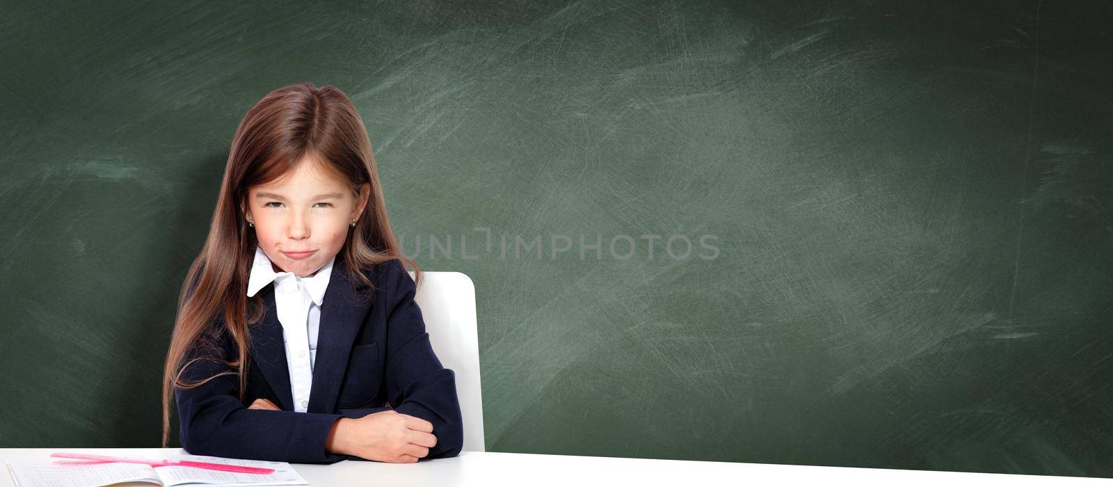 Frustrated and unhappy teen girl at school. by Taut