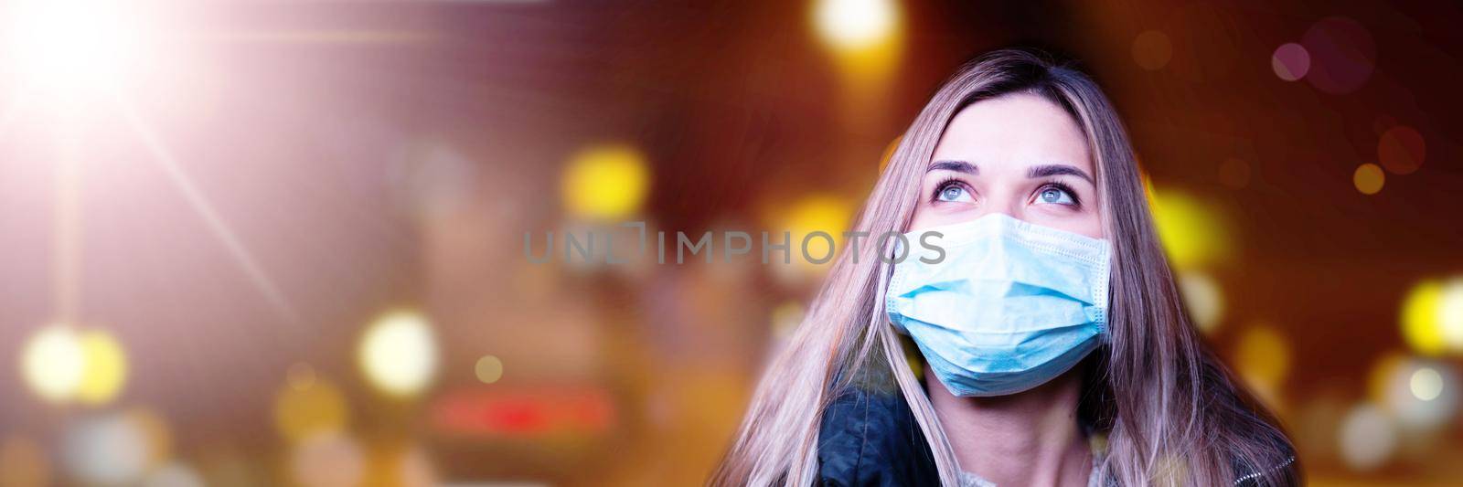 Portrait of a young girl in a medical mask. by Taut