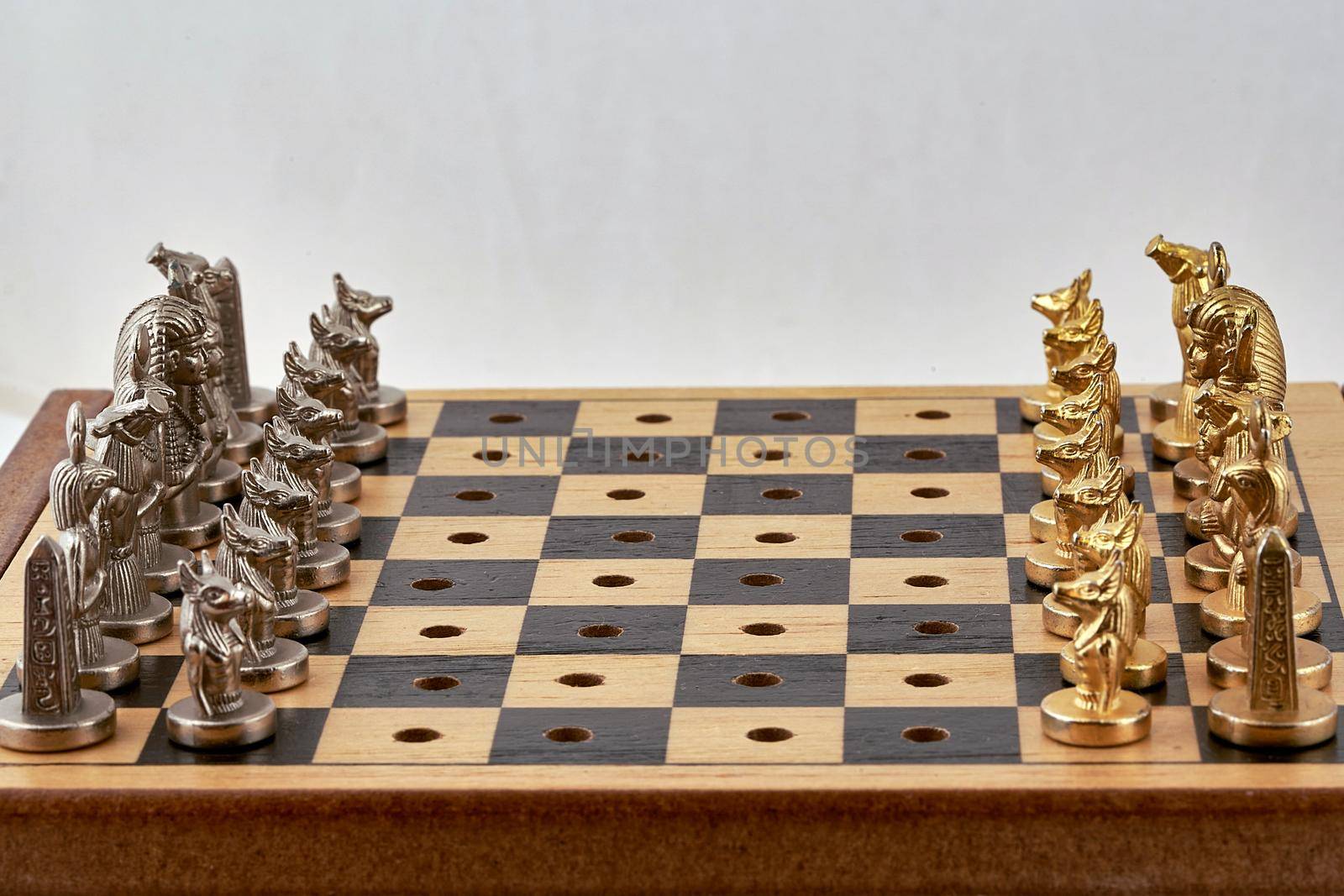 Chess pieces are placed on the board before the start of the game. Close up