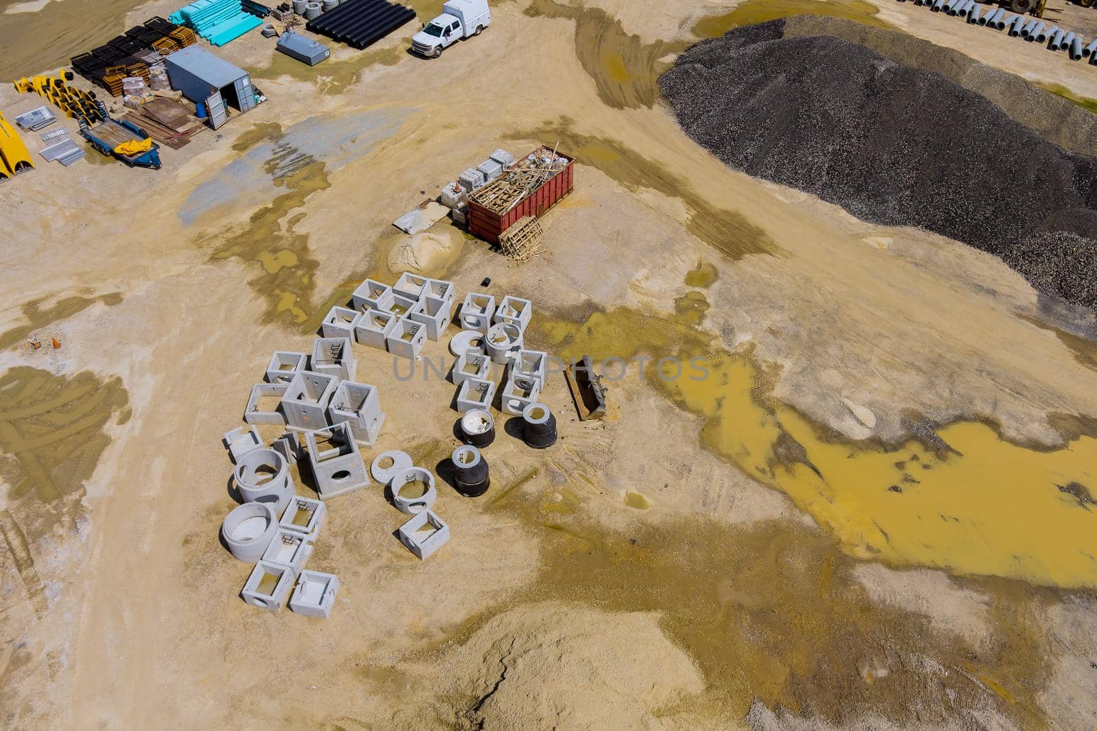 Aerial panoramic view of work preparing ground under construction area with laying drain manholes for water system by ungvar
