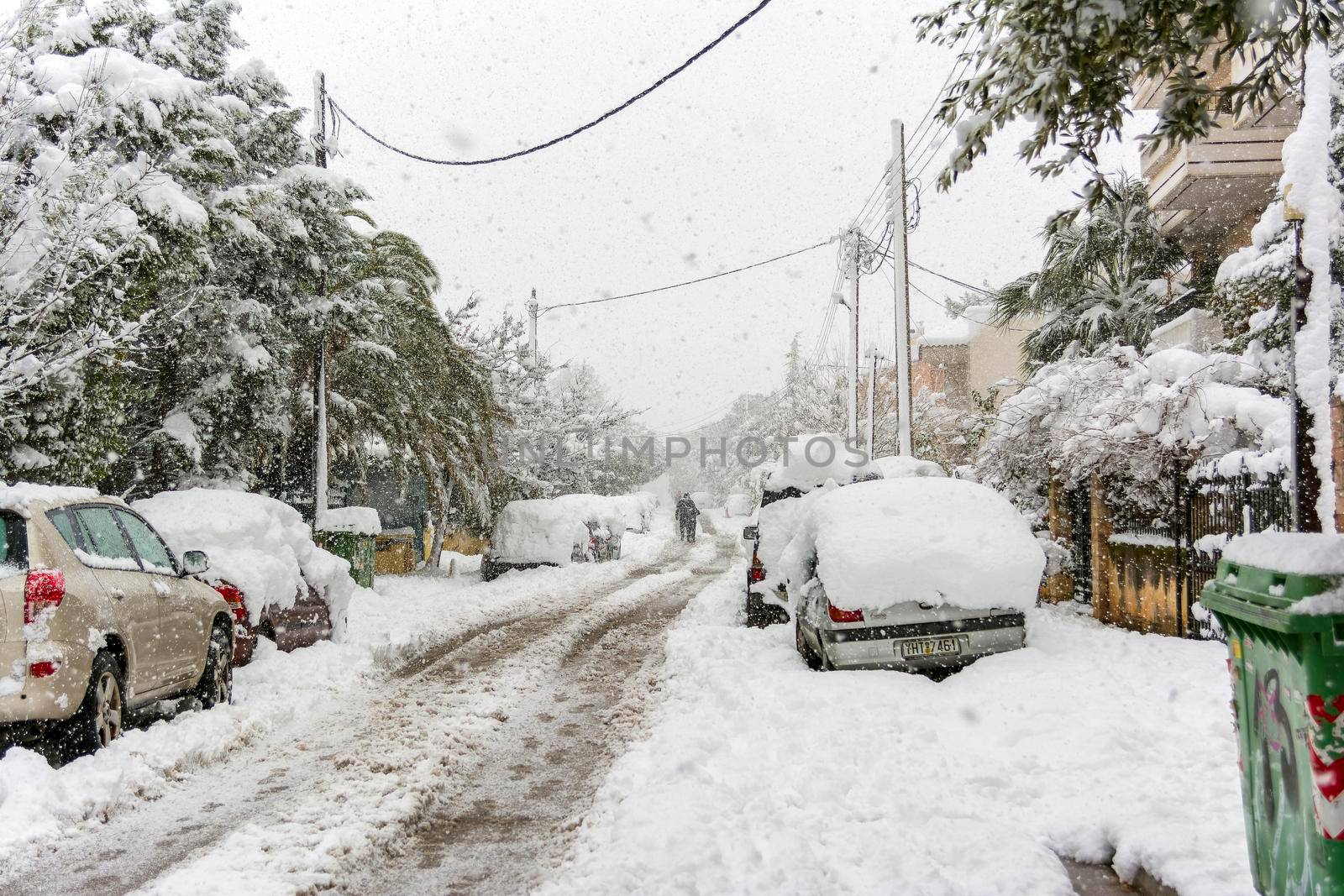 Cars totally covered with snow in Vrilissia district, during snow storm in Athens city, capital of Greece, Europe by ankarb