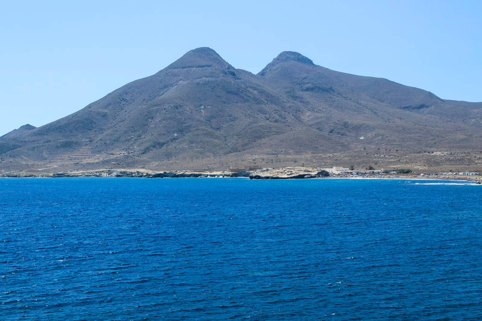 Beautiful seascape in Isleta del Moro village. Volcanous in the background.
