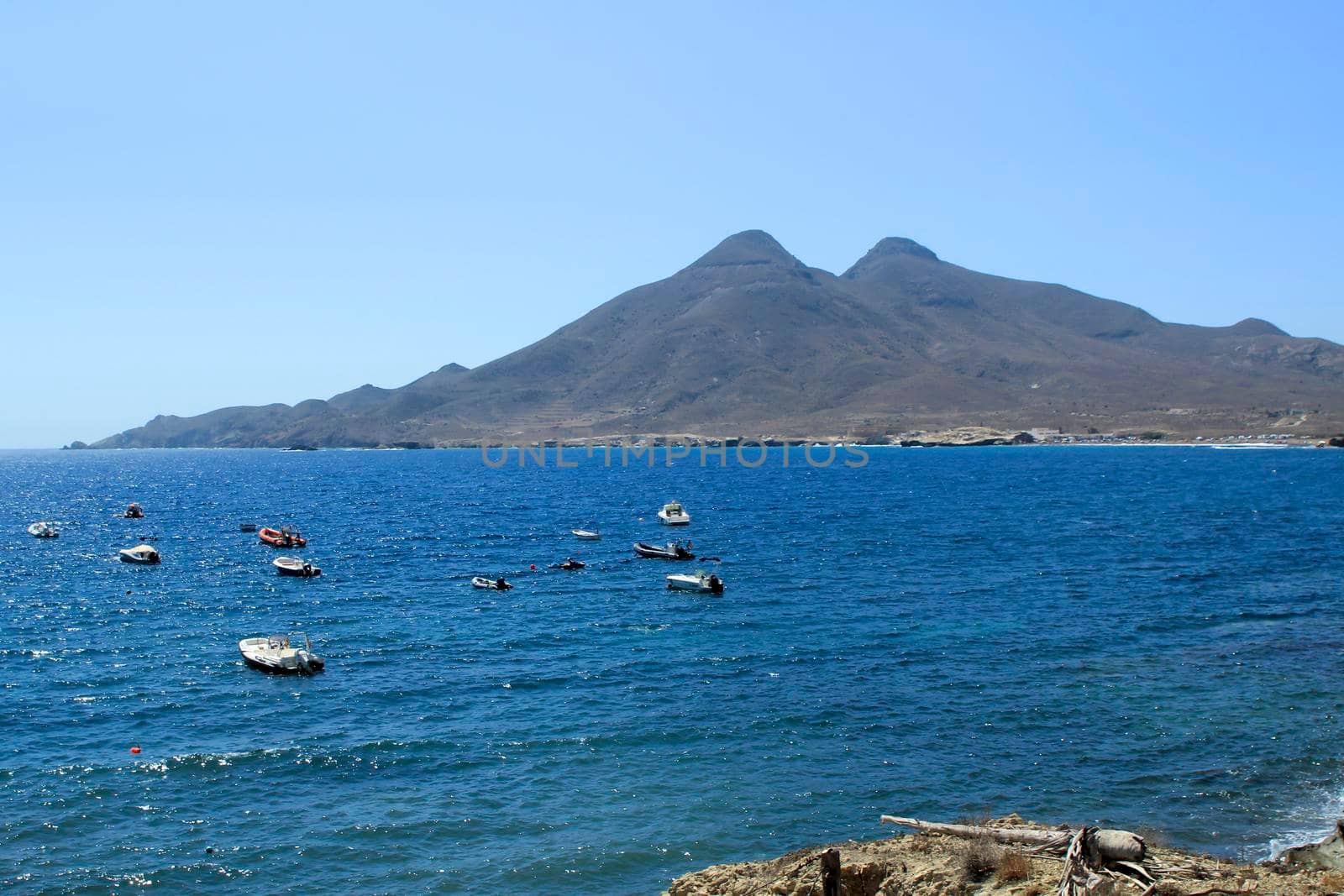 Beautiful seascape in Isleta del Moro village. Volcanous in the background.