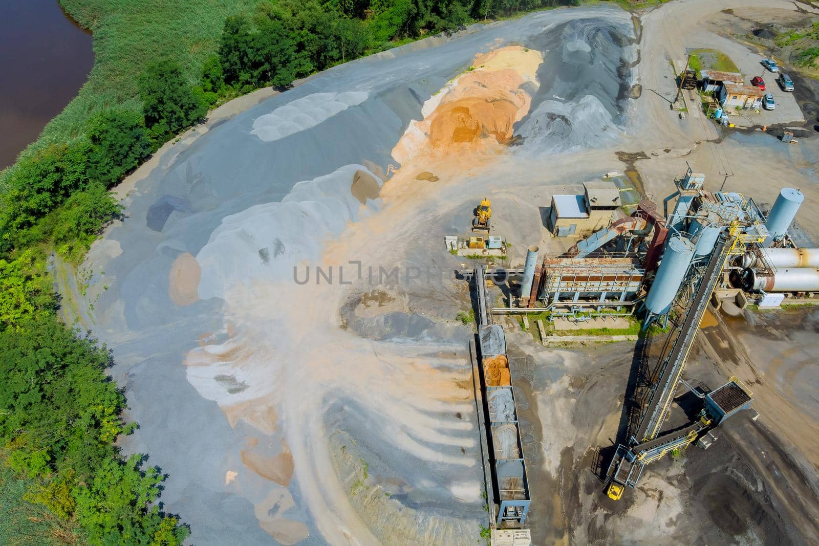 Aerial view of open cast mining panorama quarry with work of machinery equipment at a quarries