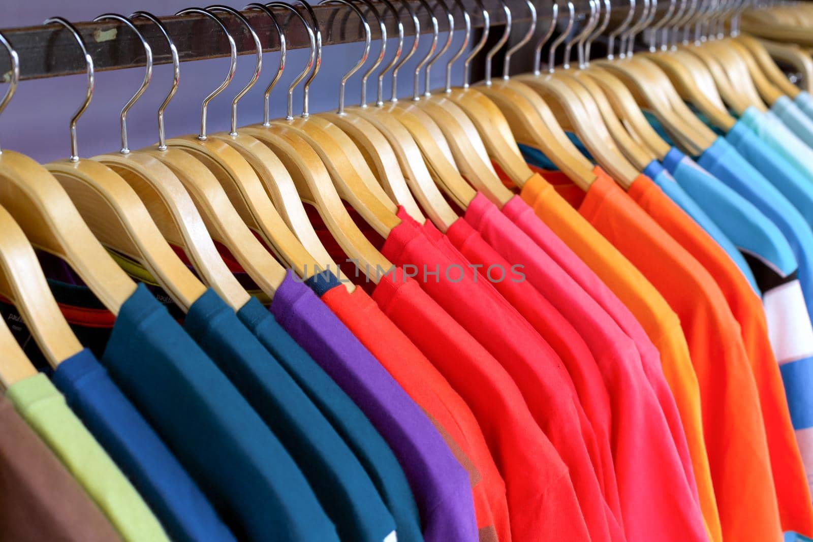 New clothes colorful in a shop store. by jayzynism
