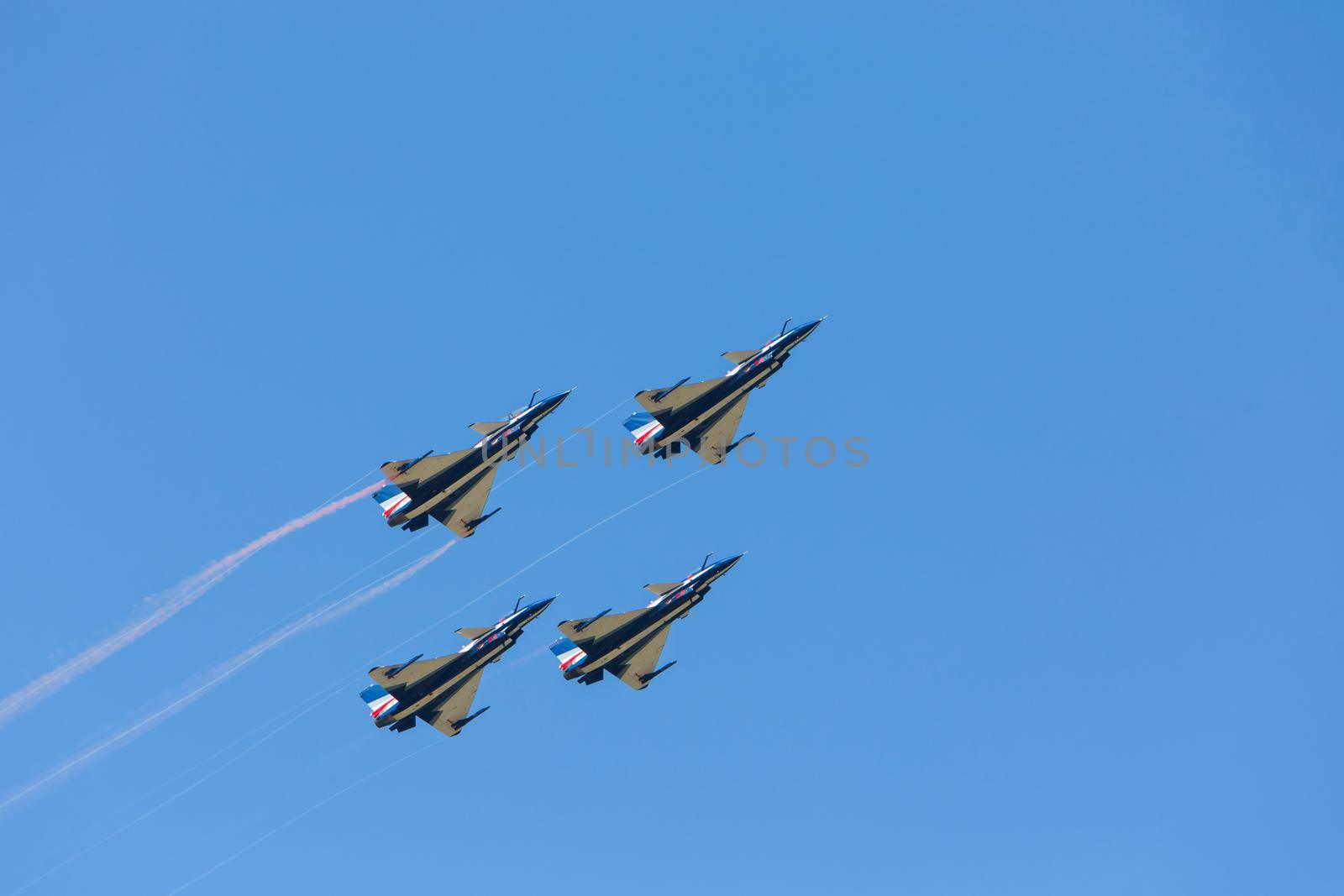 Nakhonratchasima, THAILAND November 26, 2015 : F16 Gripen and August 1st Aerobatic team" engaged in acrobatics.