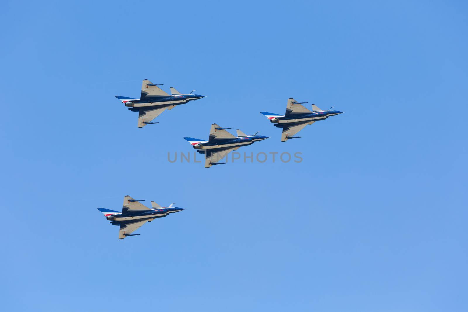 Nakhonratchasima, THAILAND November 26, 2015 : F16 Gripen and August 1st Aerobatic team" engaged in acrobatics. by jayzynism