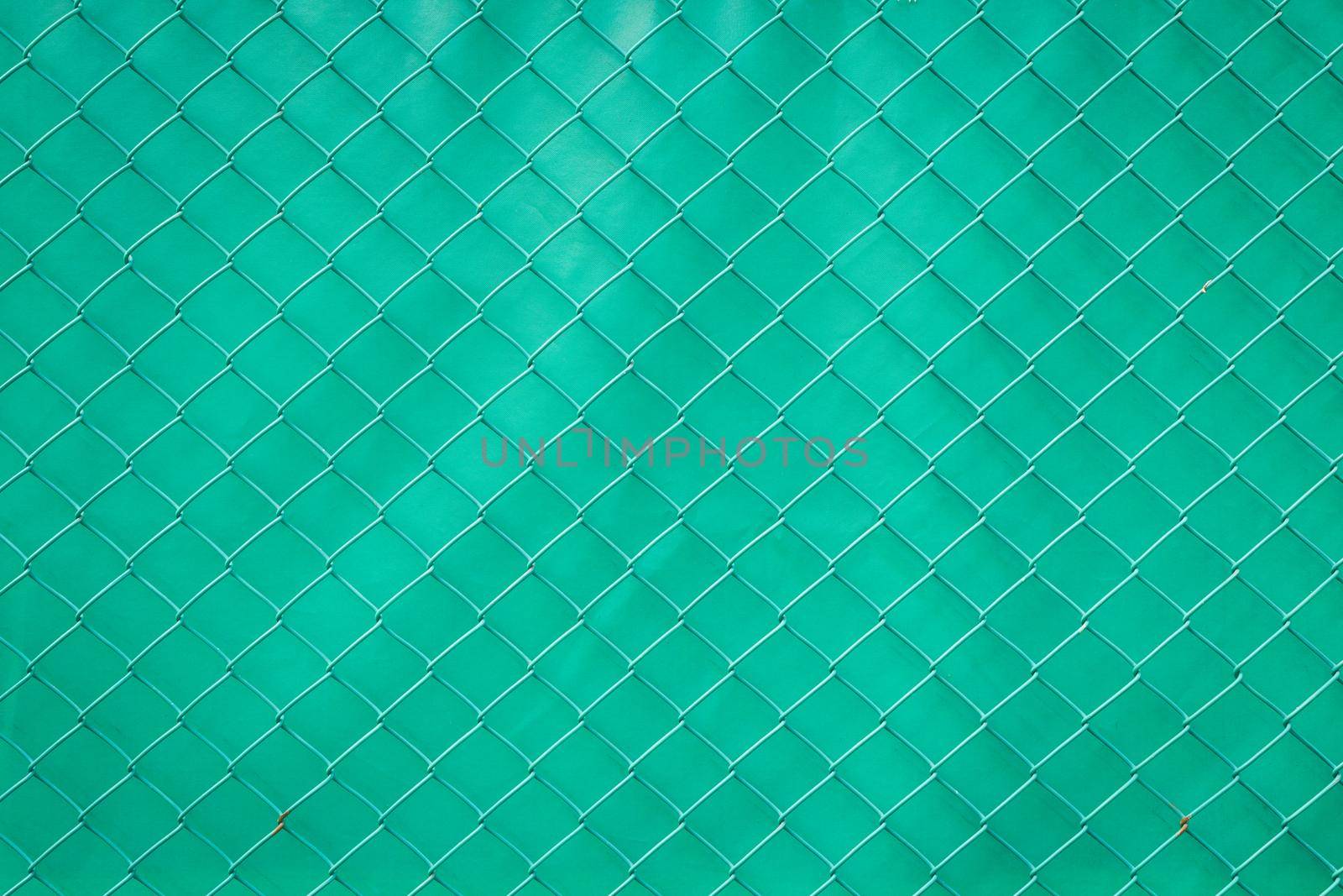 Steel mesh rusty on green background.