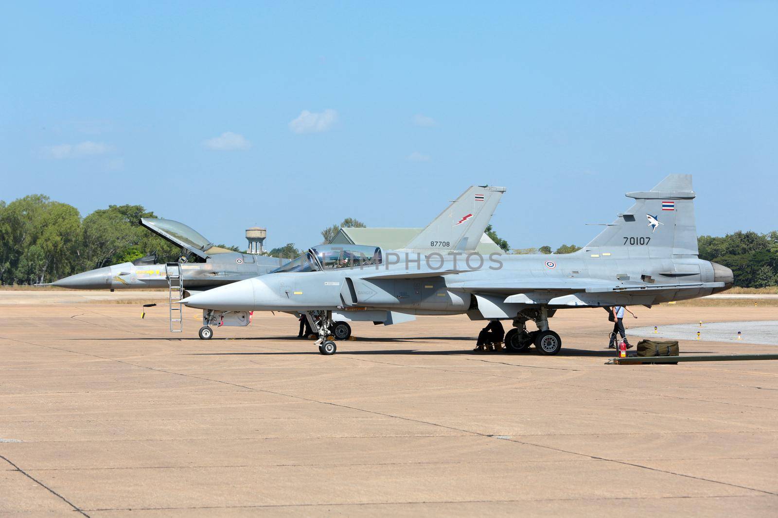 Nakhonratchasima, THAILAND November 27, 2015 : F16 Gripen and August 1st Aerobatic team" engaged in acrobatics. by jayzynism