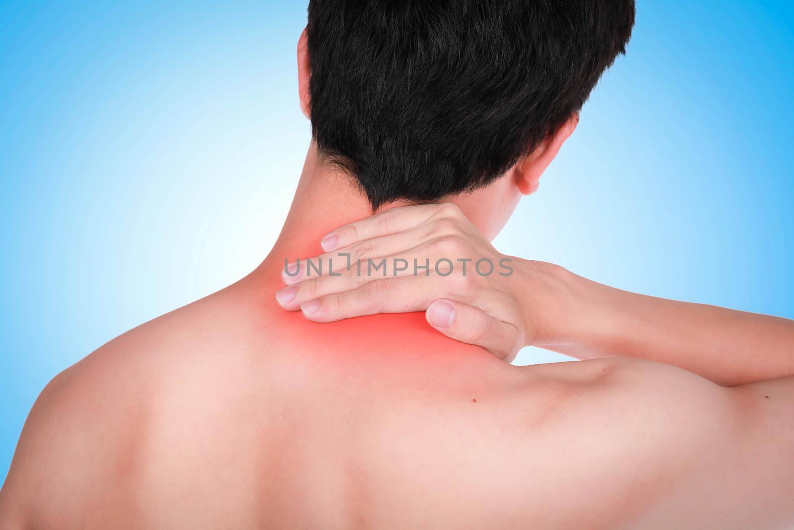 Close up suffering male pain in neck on blue background. by jayzynism