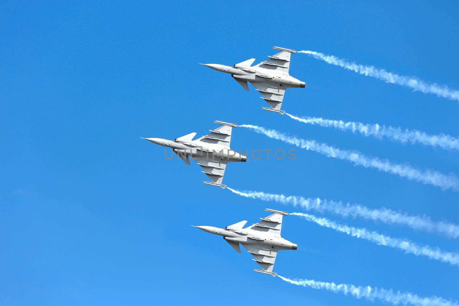 Nakhonratchasima, THAILAND November 27, 2015 : F16 Gripen and August 1st Aerobatic team" engaged in acrobatics.