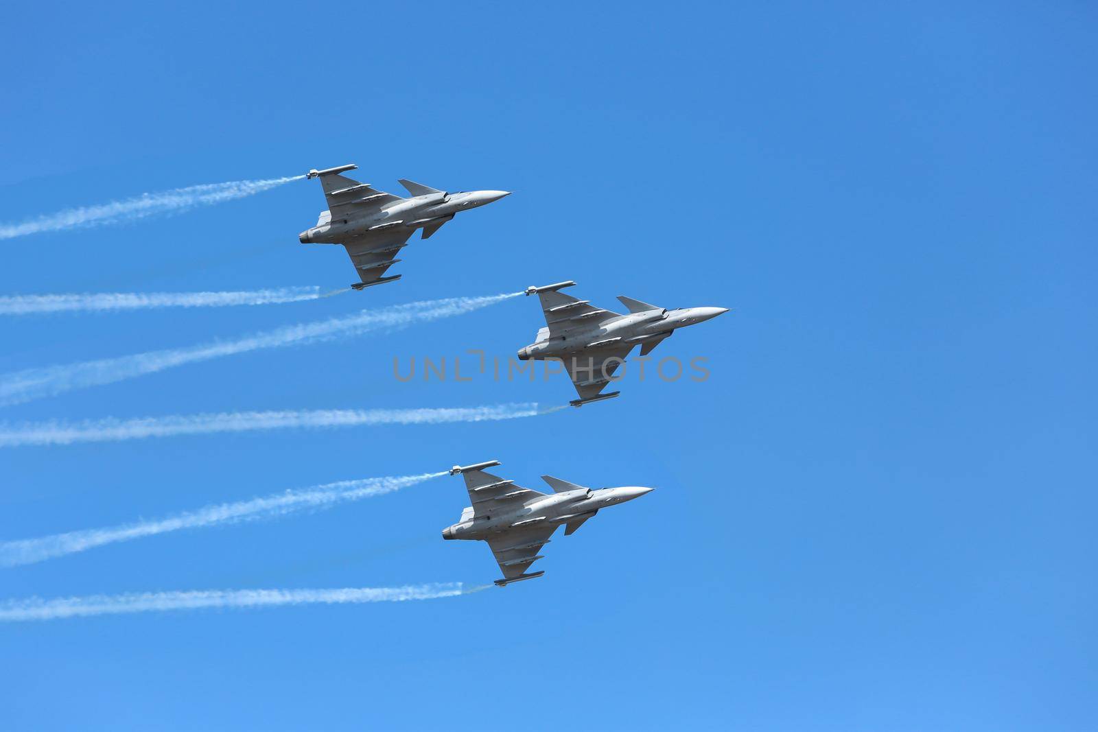 Nakhonratchasima, THAILAND November 27, 2015 : F16 Gripen and August 1st Aerobatic team" engaged in acrobatics.