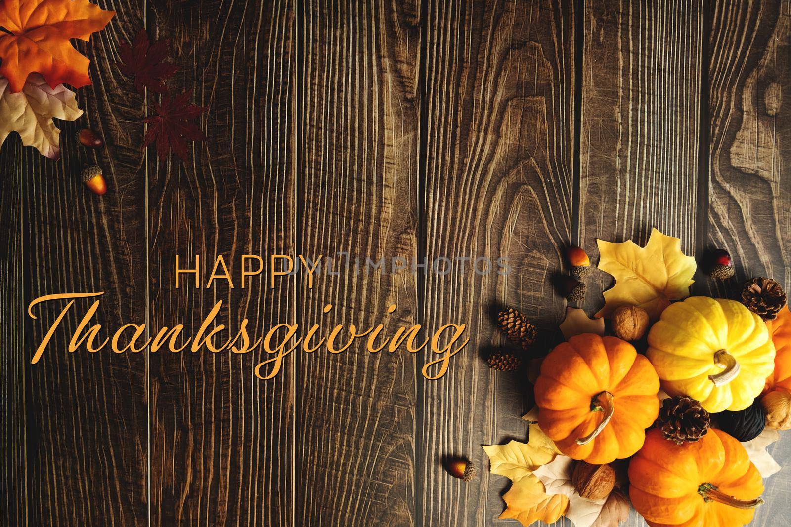 Happy Thanksgiving Day with pumpkin and nut on wooden table