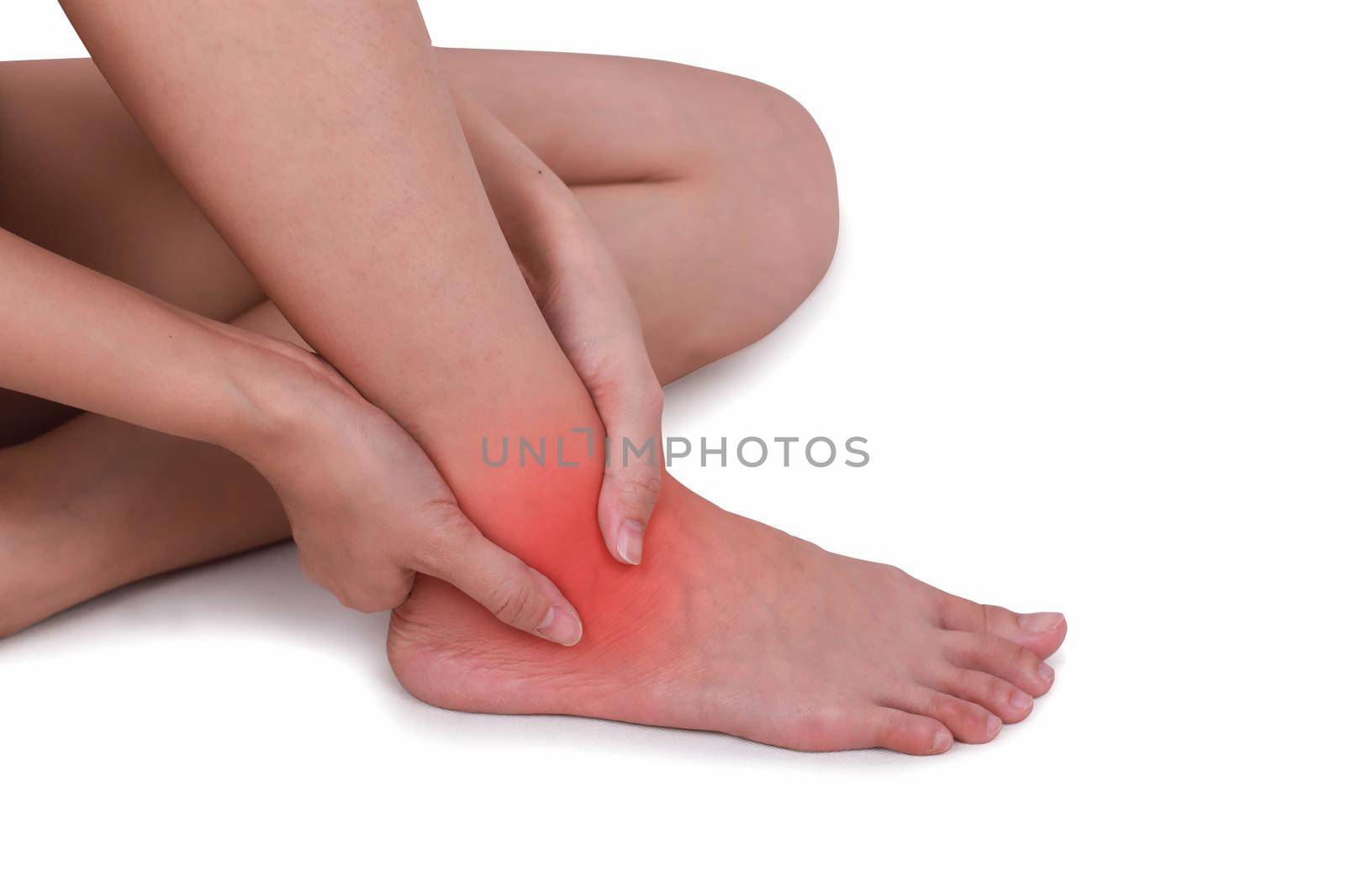 Close up suffering male pain in ankle isolated white background. by jayzynism