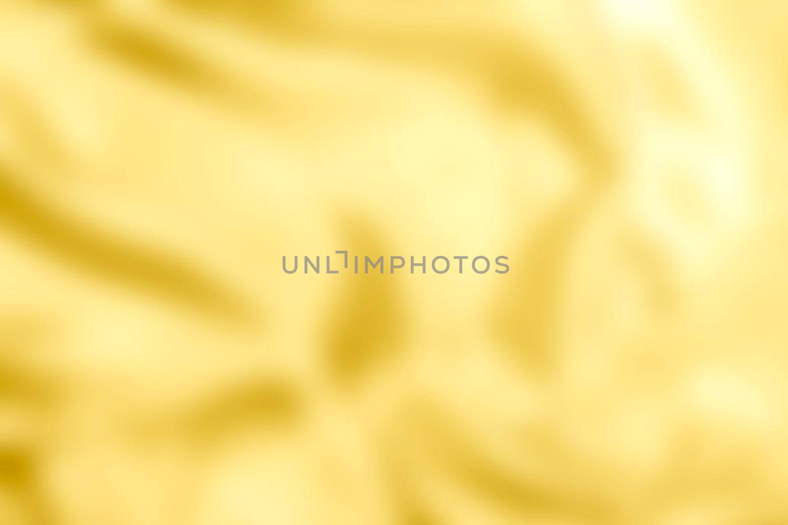 Gold blurry abstract background texture.